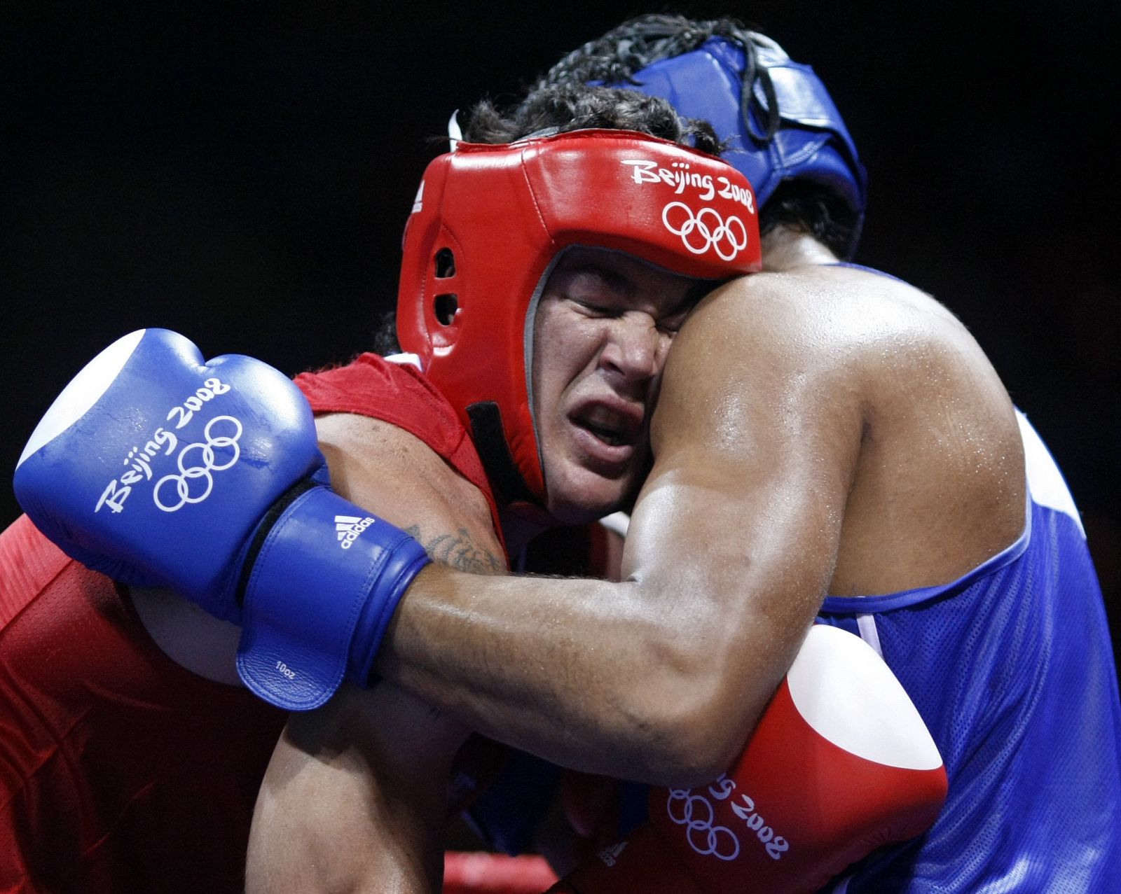 Pitt of Australia fights Arjaoui of Morocco during their men's heavyweight (91kg) round of 16 boxing match at the Beijing 2008 Olympic Games