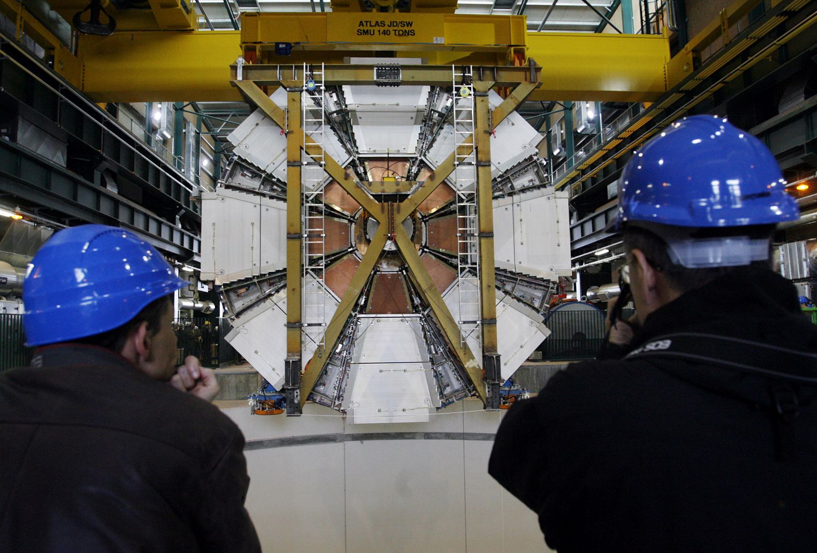 The last element of the ATLAS experiment is lowered into the cave at the CERN in Meyrin near Geneva