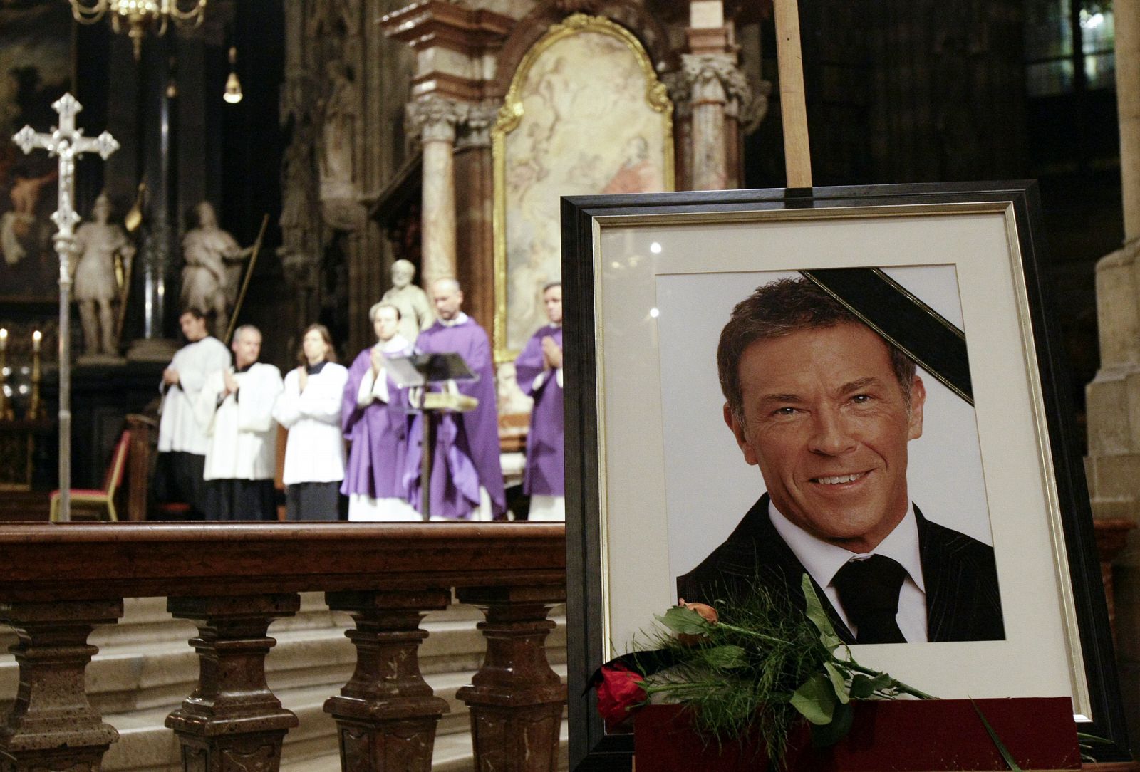 A photo of Austrian far right leader Haider stands in St. Stephens Cathedral in Vienna