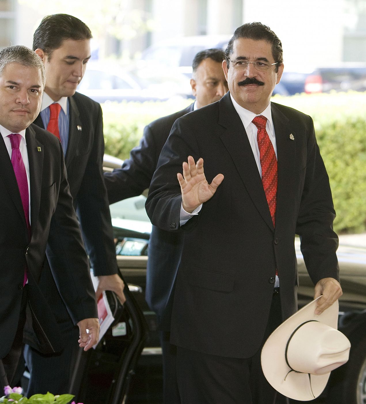 Ousted Honduran President Zelaya waves as he arrives at U.S. State Department for meeting with U.S. Secretary of State Clinton in Washington