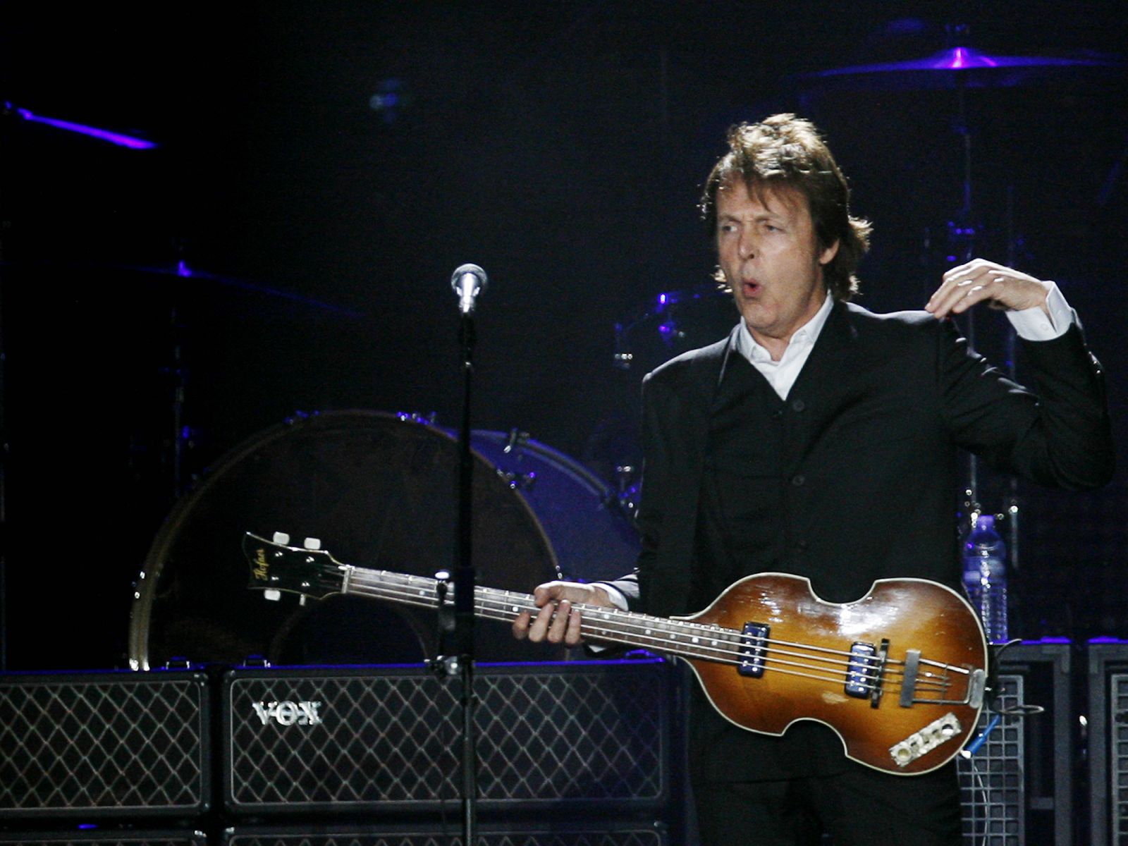 Paul McCartney, formerly a member of The Beatles, performs with his band during a concert at CitiField in New York
