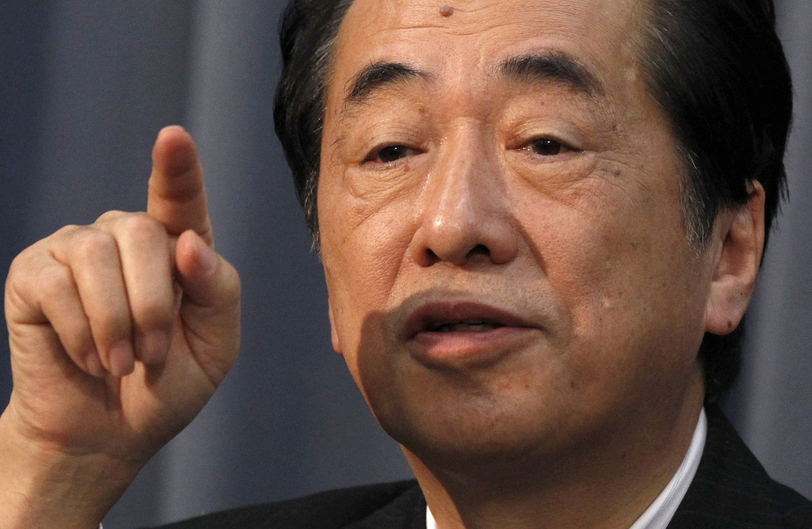 Japan's new Finance Minister Naoto Kan speaks during his first news conference as the minister in Tokyo