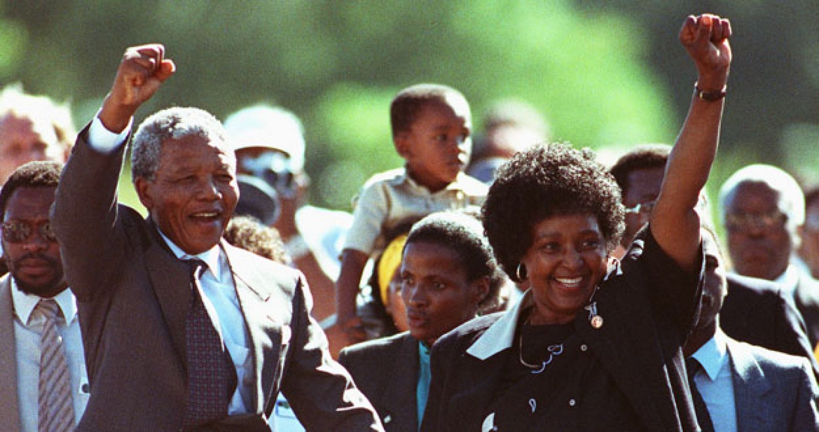 Black nationalist leader Nelson Mandela and his wife Winnie salute well-wishers as he leaves Victor ..