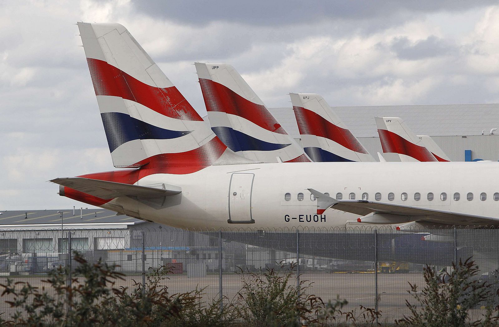 British Airways aircrafts sit parked at Heathrow airport