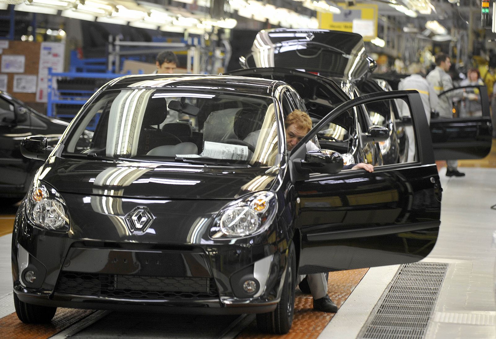 A worker checks a Renault Twingo in the Revoz assembly line in Novo Mesto