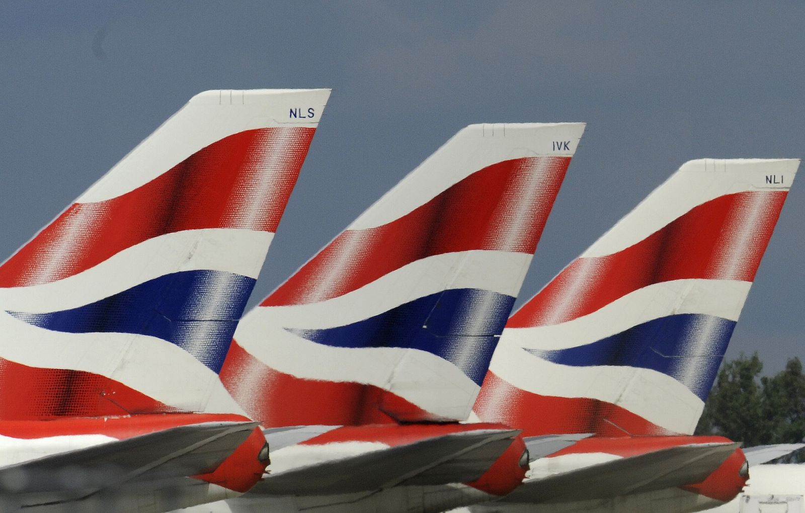 British Airways aircraft tailfins are seen at Heathrow Airport in west London