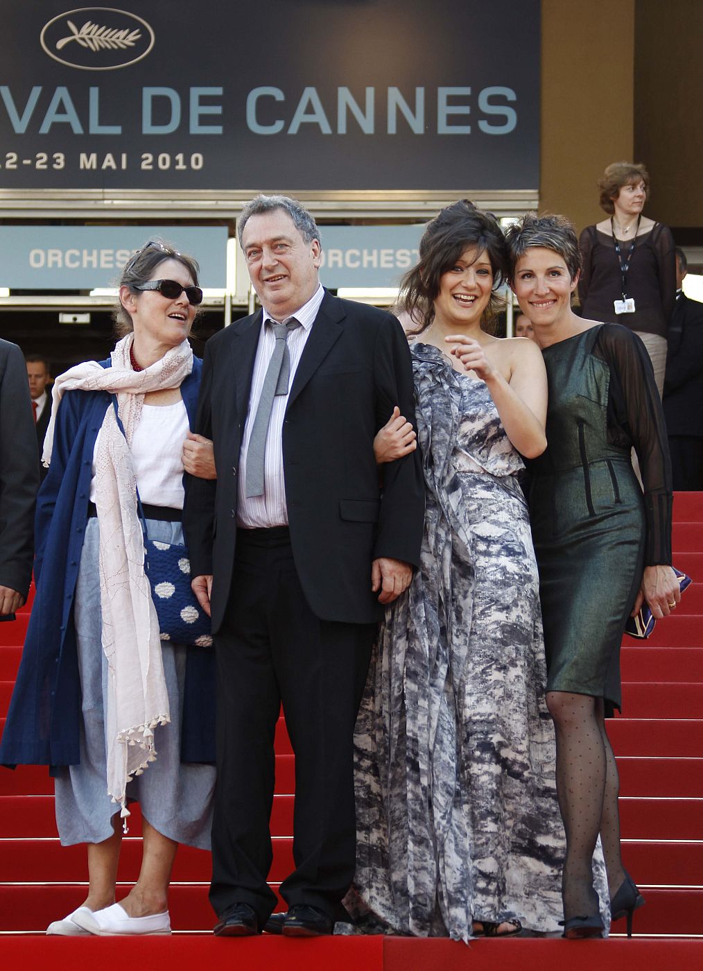 Director Stephen Frears poses with an unidentified women and cast member Tamsin Greig on the red carpet as they arrive at the 63rd Cannes Film Festival