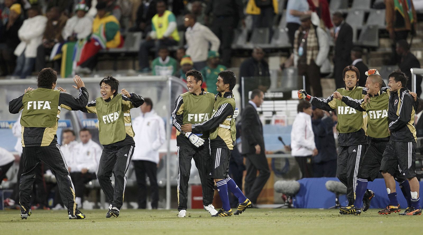 Japan players celebrates their team's win over Cameroon after the 2010 World Cup Group E soccer match at Free State stadium in Bloemfontein