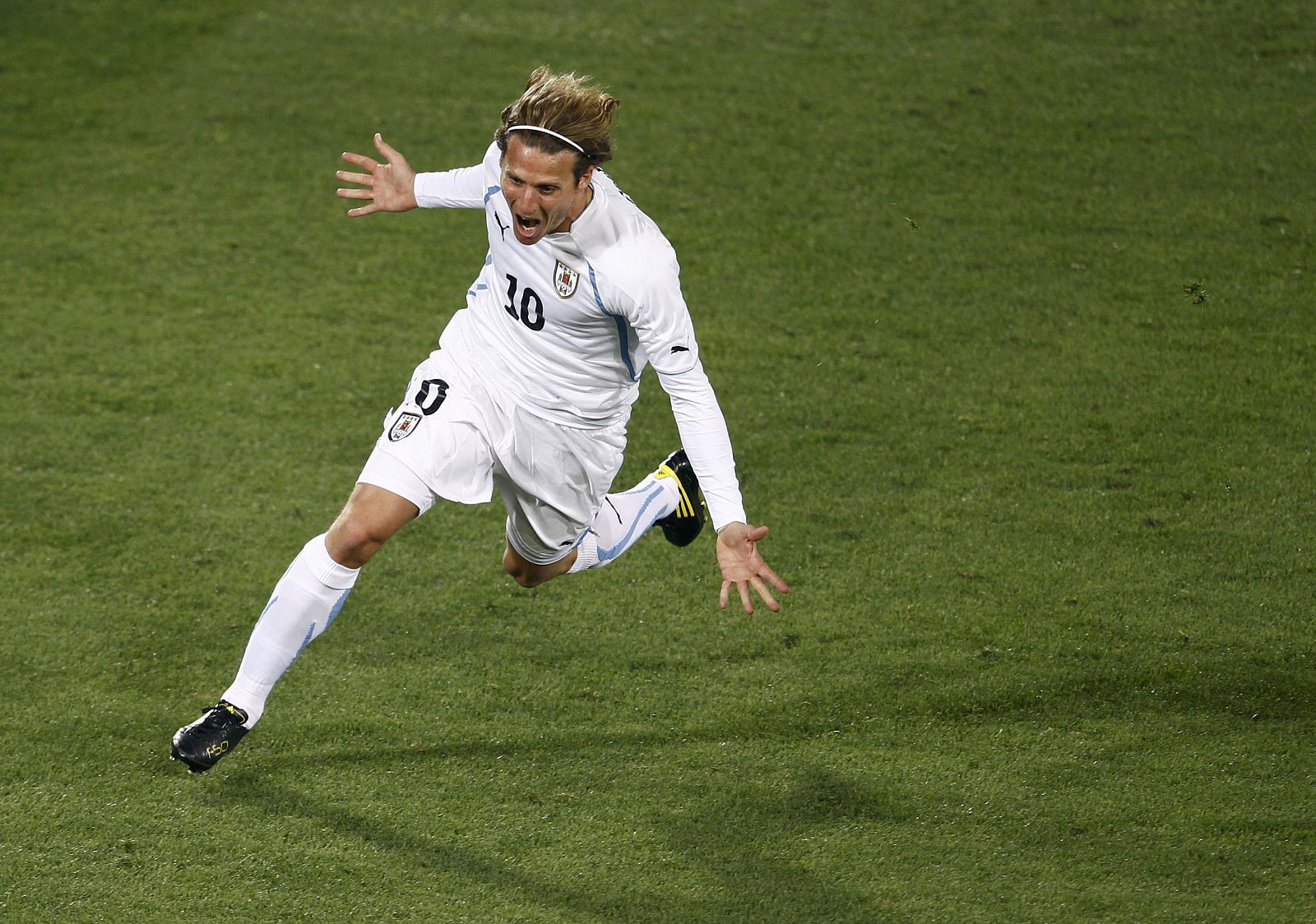 Uruguay's Forlan celebrates his goal during the 2010 World Cup Group A soccer match against South Africa at Loftus Versfeld stadium in Pretoria