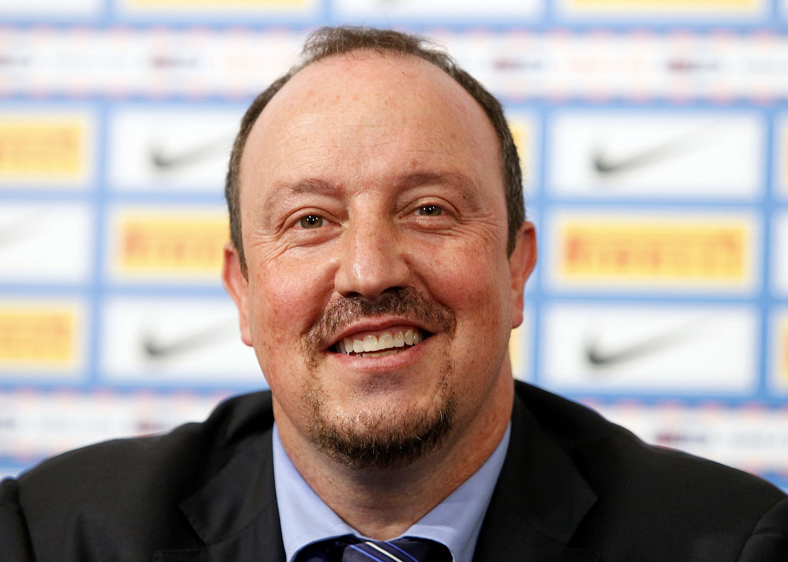 Benitez smiles at a news conference during his official unveiling as head coach of Inter Milan at the team's training center in Appiano Gentile, northern Milan