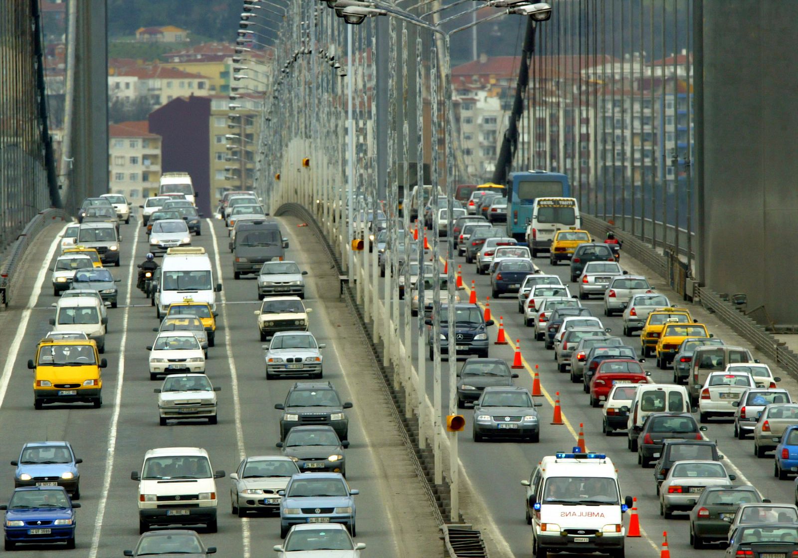 Motorists drive on the Bosphorus bridge which links the European and Asian sides of Turkey's largest..