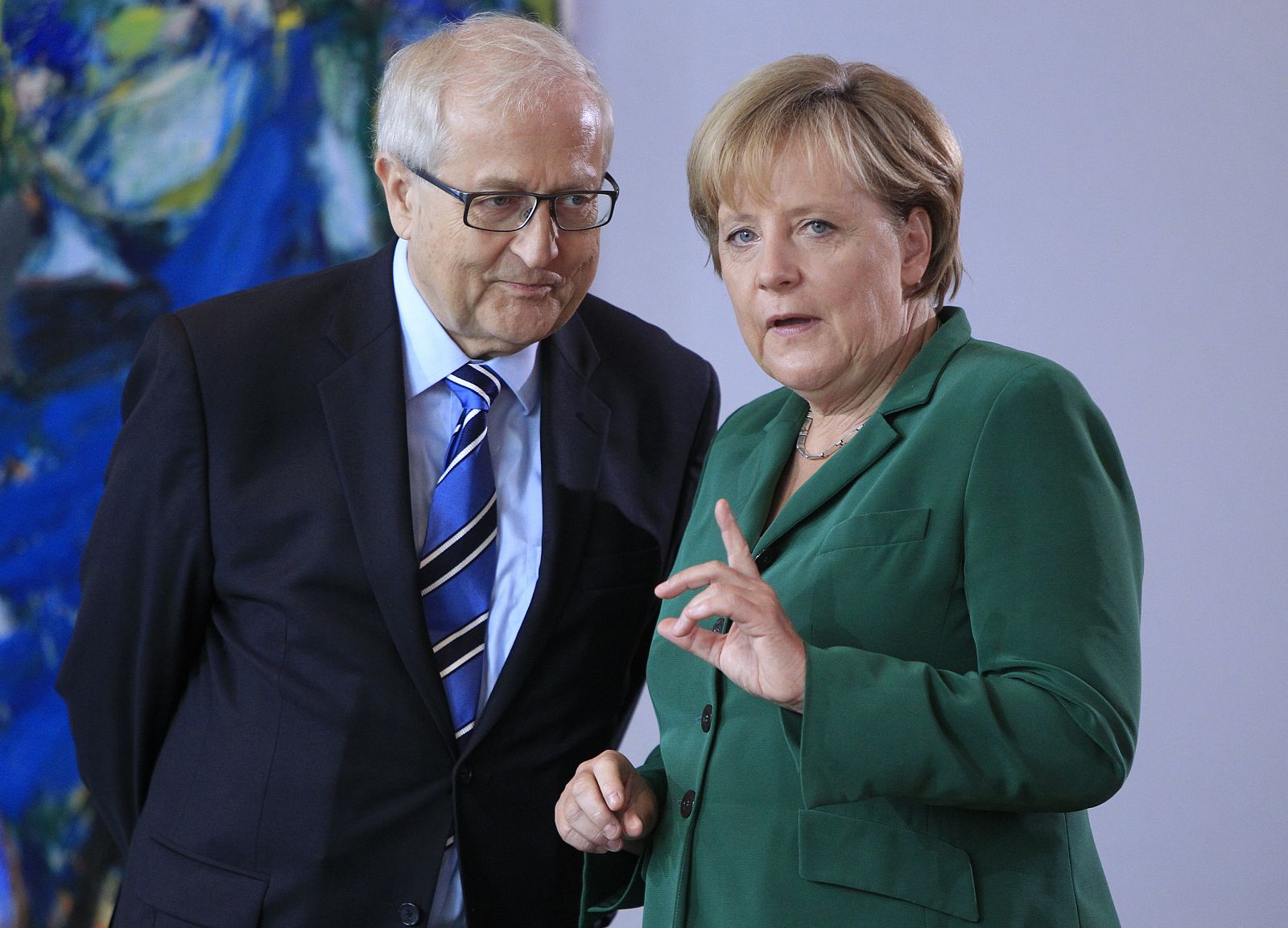 German Chancellor Merkel talks with Economics Minister Bruederle before cabinet meeting at Chancellery in Berlin