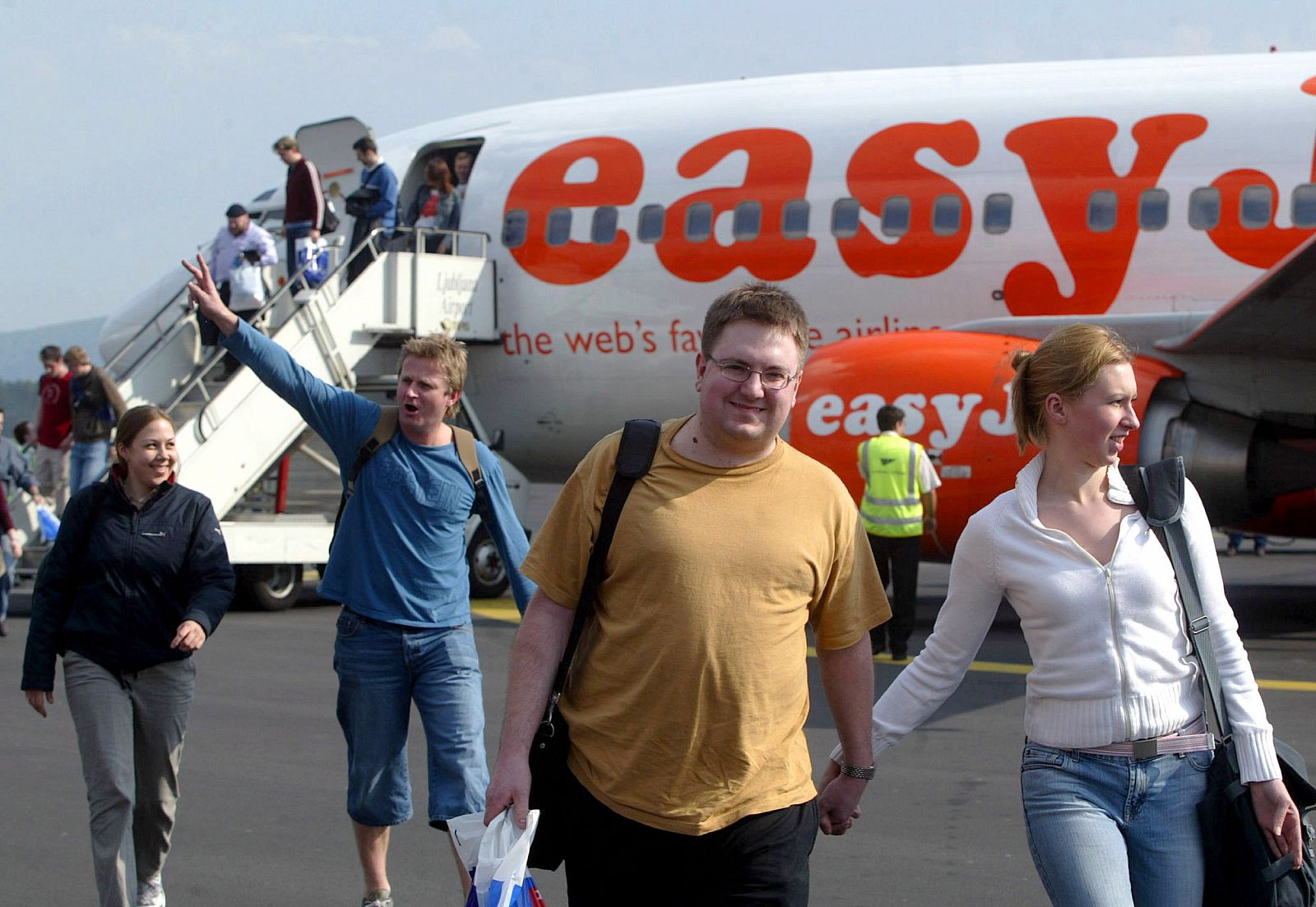 Passengers disembark from low-cost airline easyJet's plane after their inaugural flight into Ljublja..