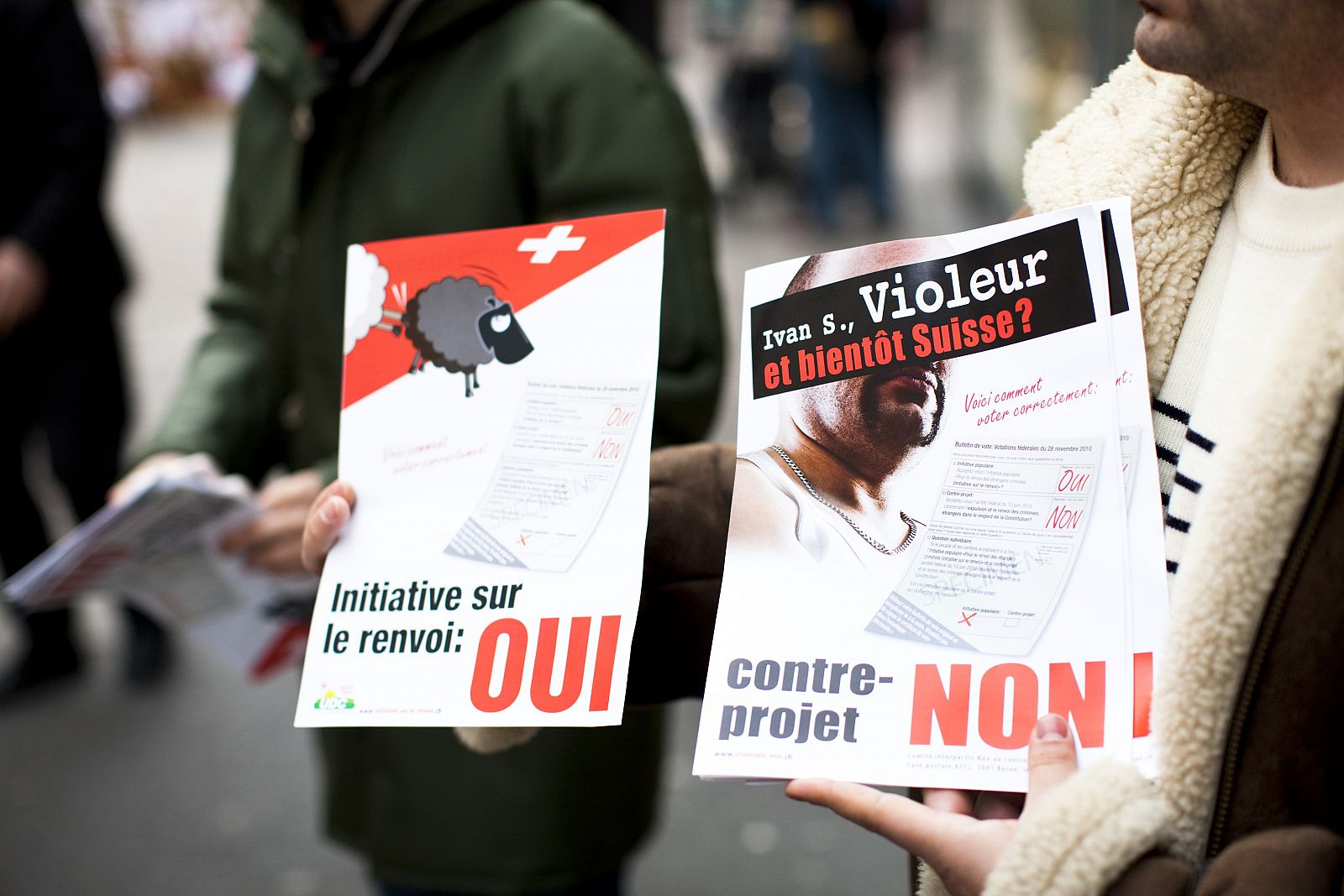 Members of the SVP hand out flyers promoting the initiative to expel foreigners in Morges