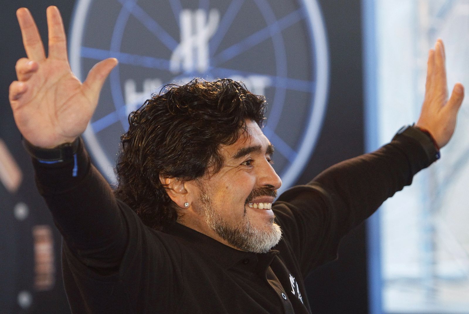 Argentina's former national soccer team coach Diego Maradona waves to his fans during a charity show in Moscow