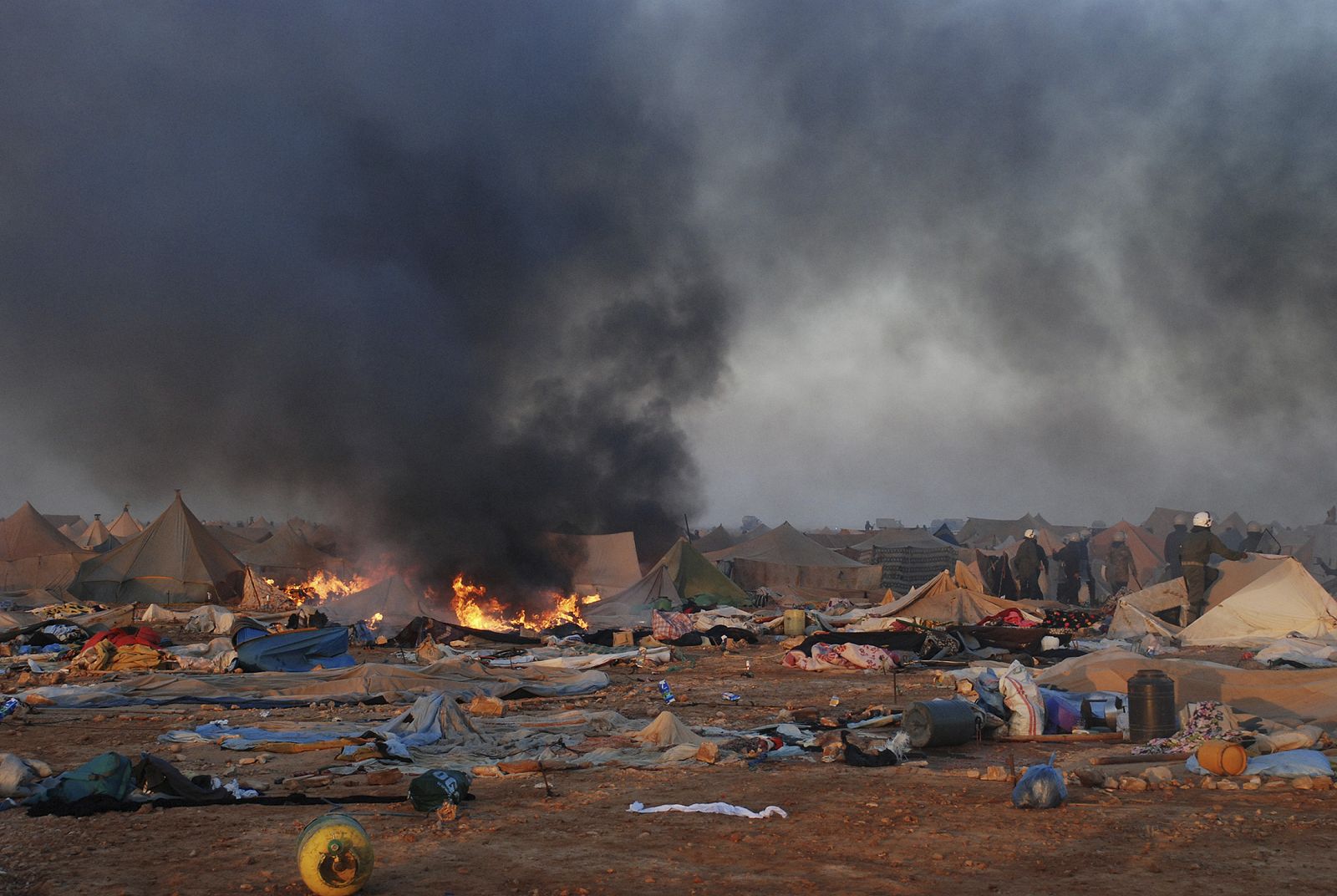 Tent burns after Moroccan security forces broke up the tent camp on the outskirts of Western Sahara's capital, Laayoune