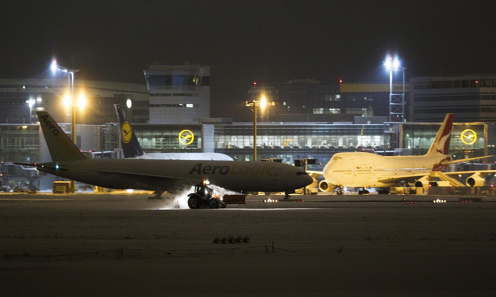 A snow plough clears the runways after heavy snowfall at Frankfurt's airport