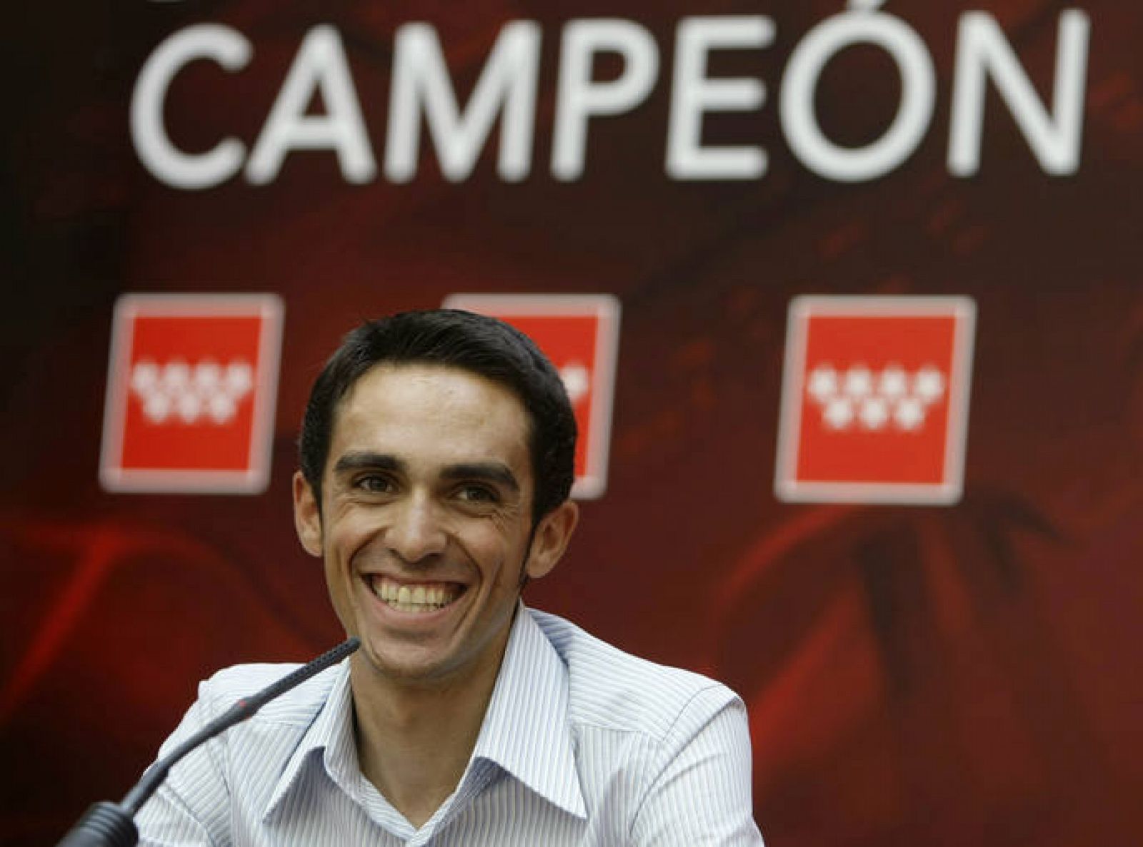 Tour de France winner Contador smiles during a news conference in Madrid