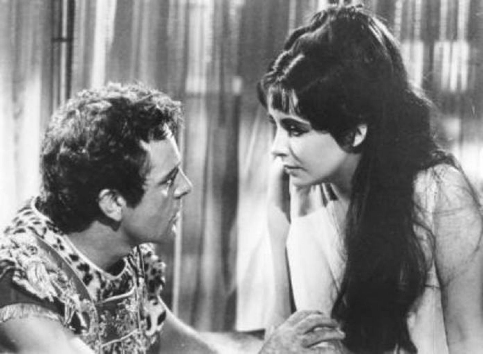 Actress Elizabeth Taylor and Richard Burton are shown in a scene from her 1963 film Cleopatra