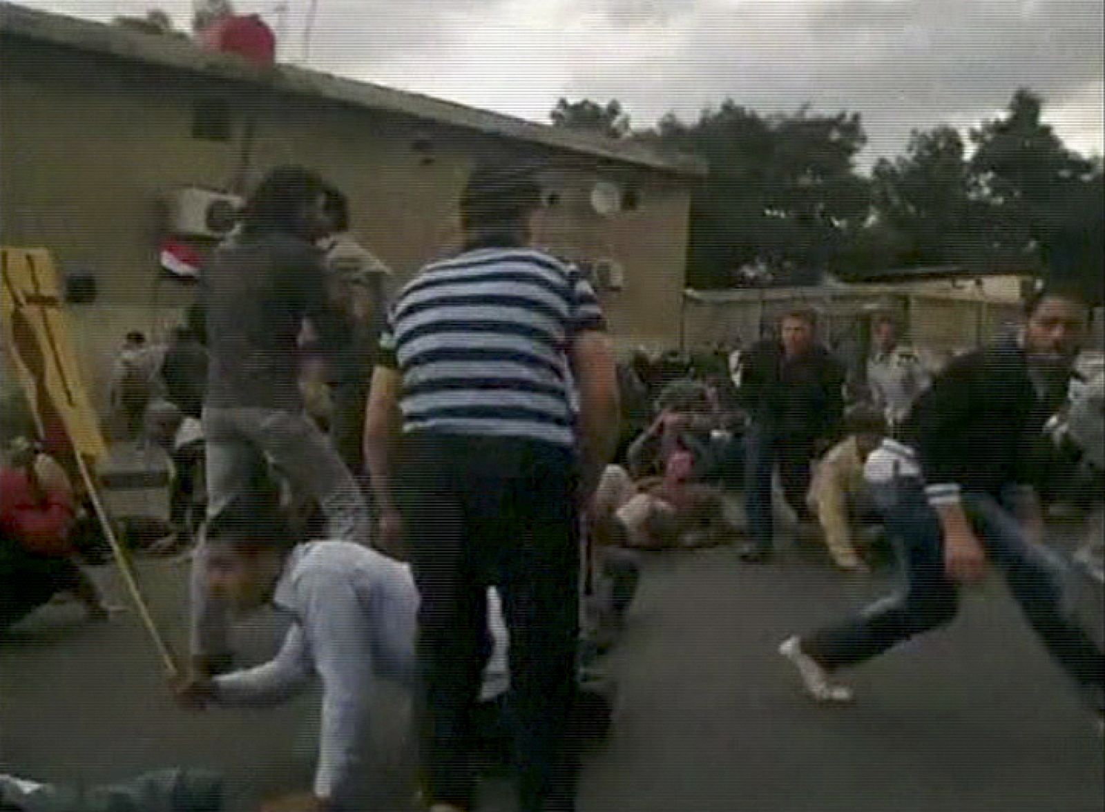 Protesters run for cover after shots were fired during a protest in Damascus in this still image taken from an amateur video footage uploaded to social networking websites