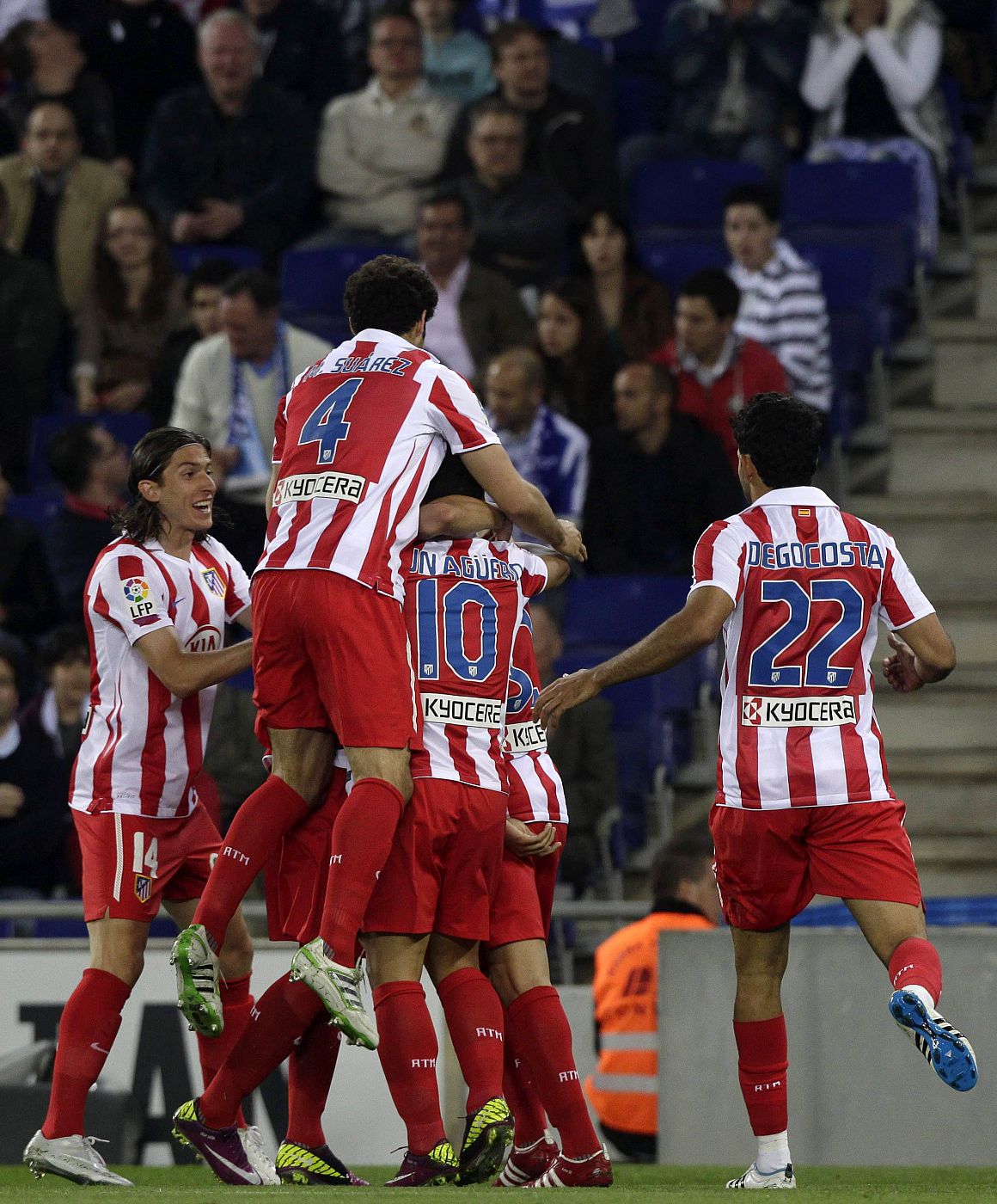 Atletico Madrid's players celebrate a goal against Espanyol during their Spanish first division soccer match at Cornella-El Prat stadium, near Barcelona
