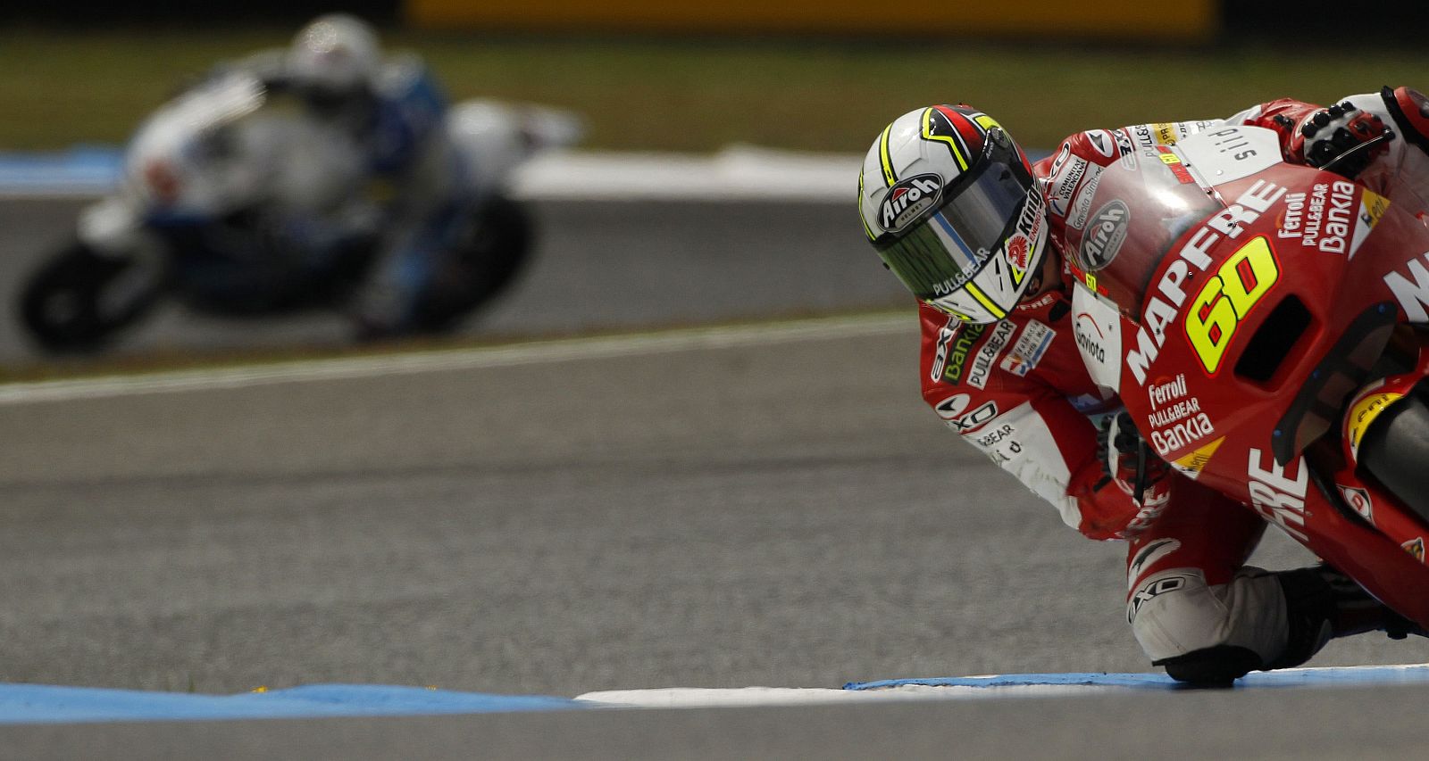 Suter Moto2 rider Simon takes a curve during a free practice session at the Portuguese Grand Prix in Estoril