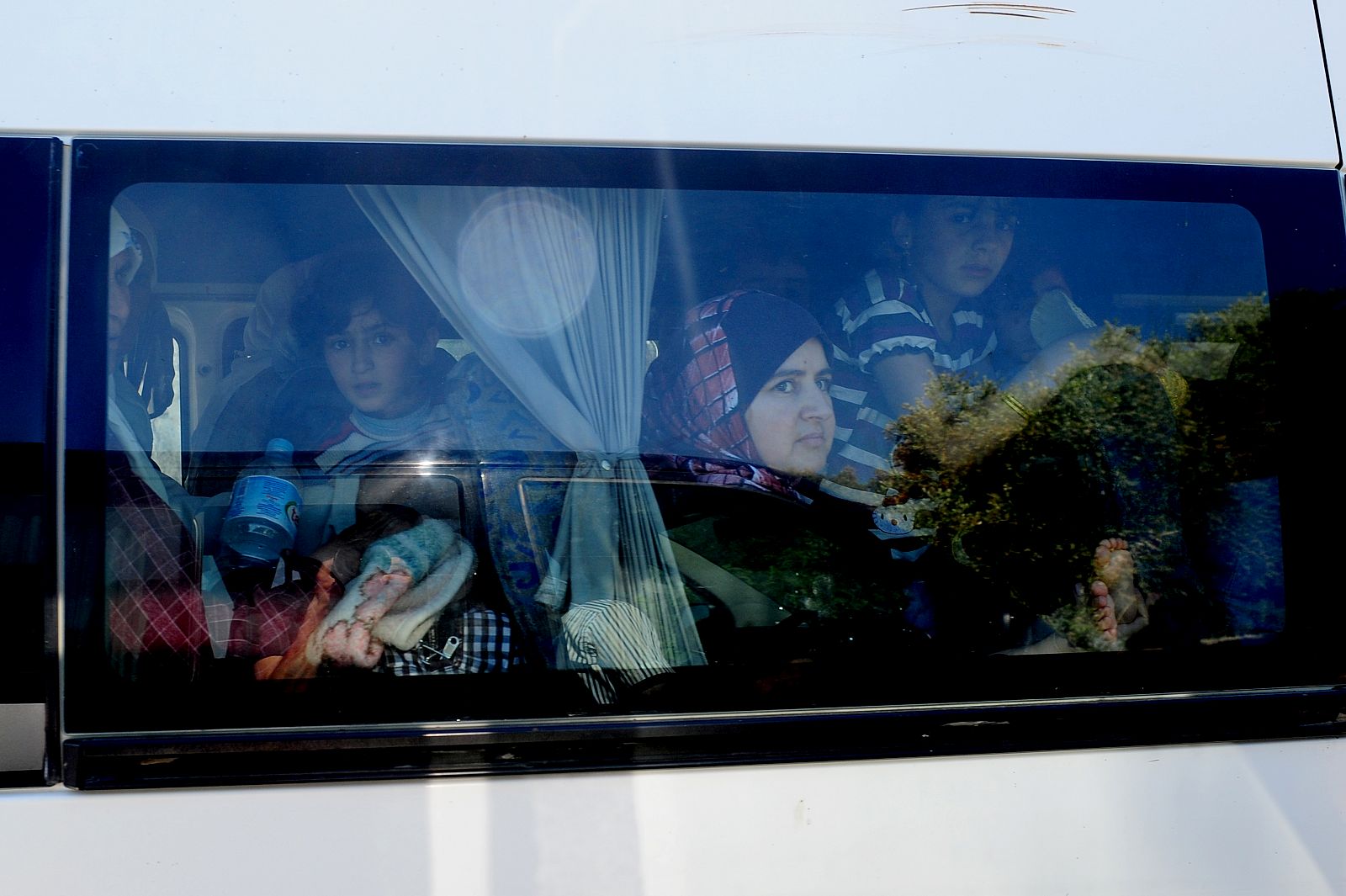 Refugiados sirios trasladados del campo de Yayladagi, en Turquía
