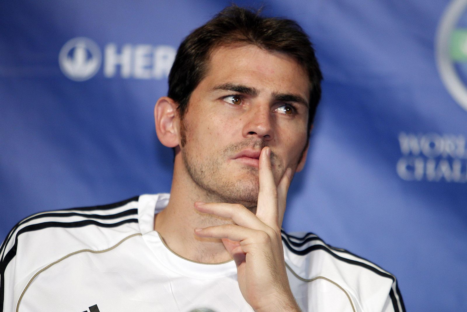Real Madrid's Casillas listens to questions from the media at a news conference in Los Angeles