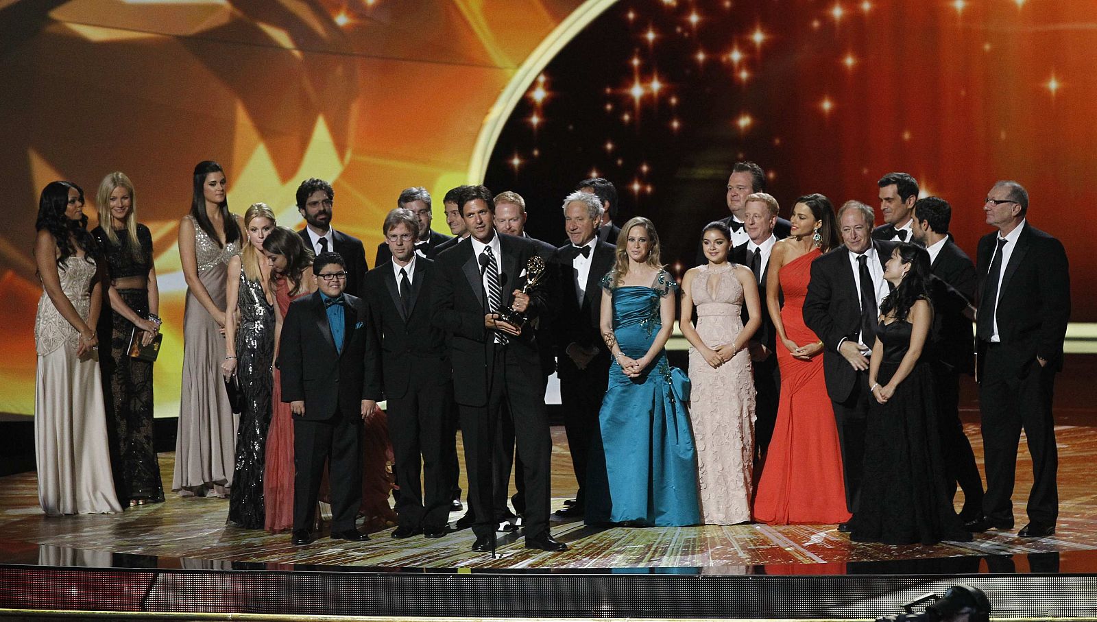 Executive producer Steve Levitan accepts the award for outstanding comedy series for "Modern Family" as cast and crew look on, at the 63rd Primetime Emmy Awards in Los Angeles