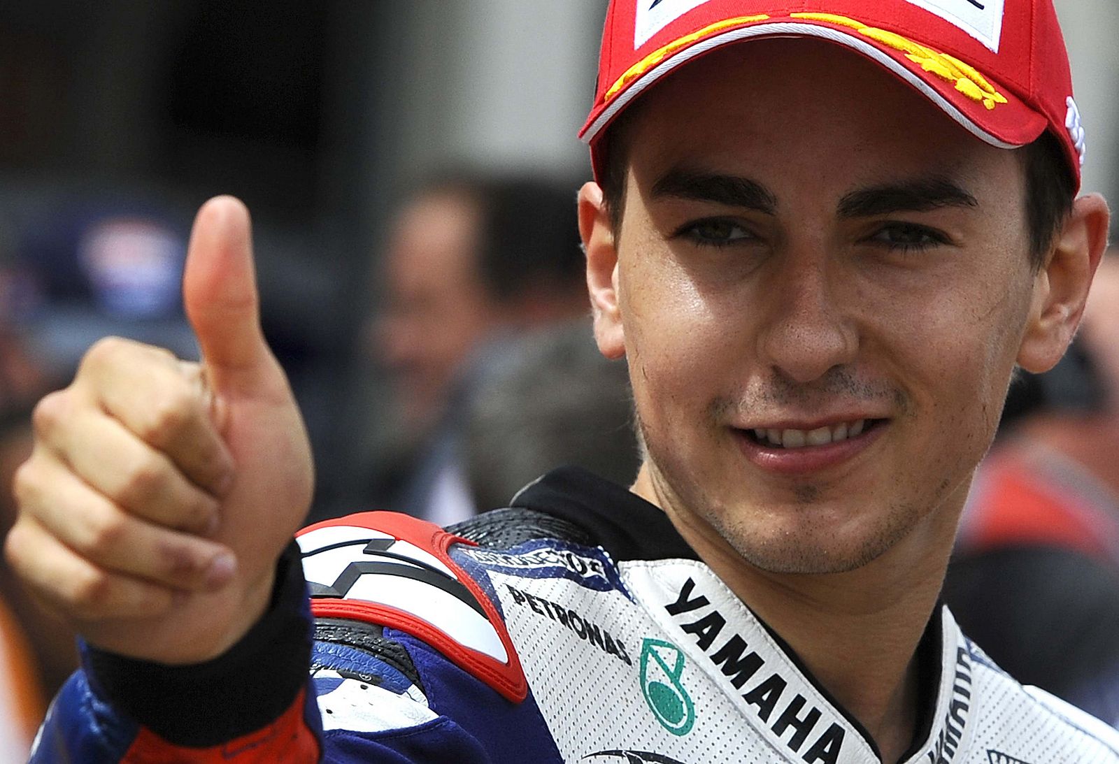 Yamaha MotoGP rider Jorge Lorenzo of Spain gives a thumbs up after placing third at the Aragon Grand Prix at Motorland racetrack in Alcaniz