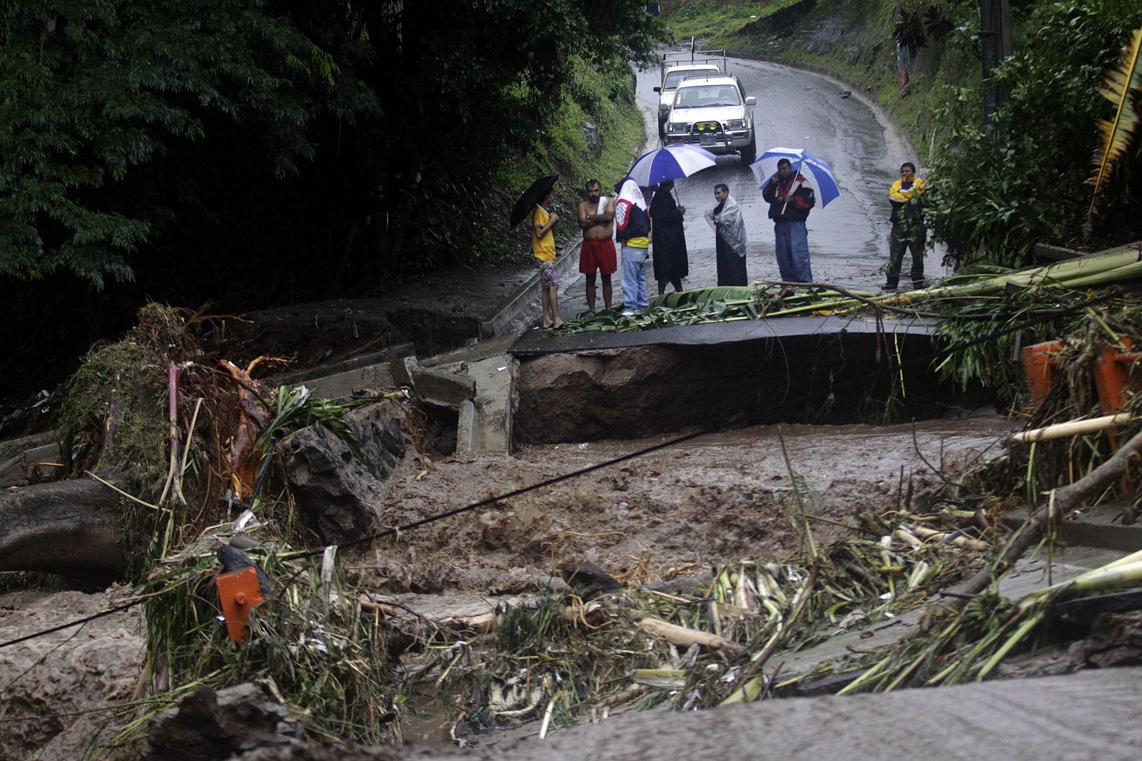 A view of a bridge flooded by the overflow of a river in the Ciudad Arce department of La Libertad