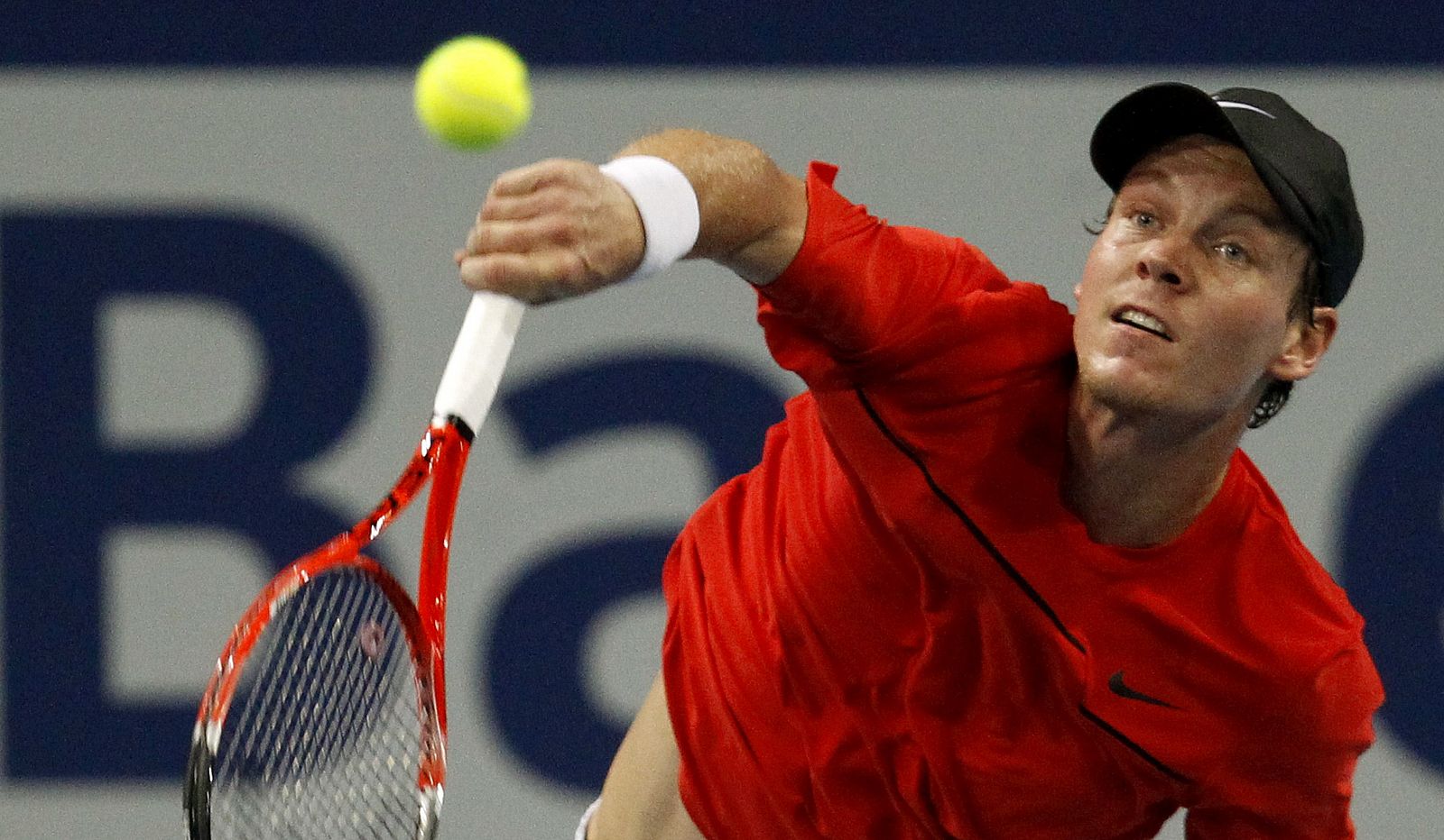Berdych of Czech Republic looks at the ball as he serves to Japan's Nishikori during their match at the Swiss Indoors ATP tennis tournament in Basel