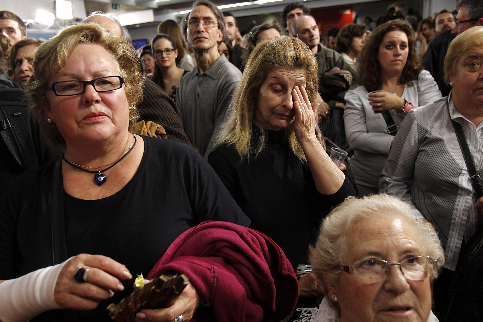 Supporters of prime ministerial candidate Alfredo Perez Rubalcaba of the Spanish Socialist Workers' Party (Partido Socialista Obrero Espanol) react at PSOE headquarters in Madrid