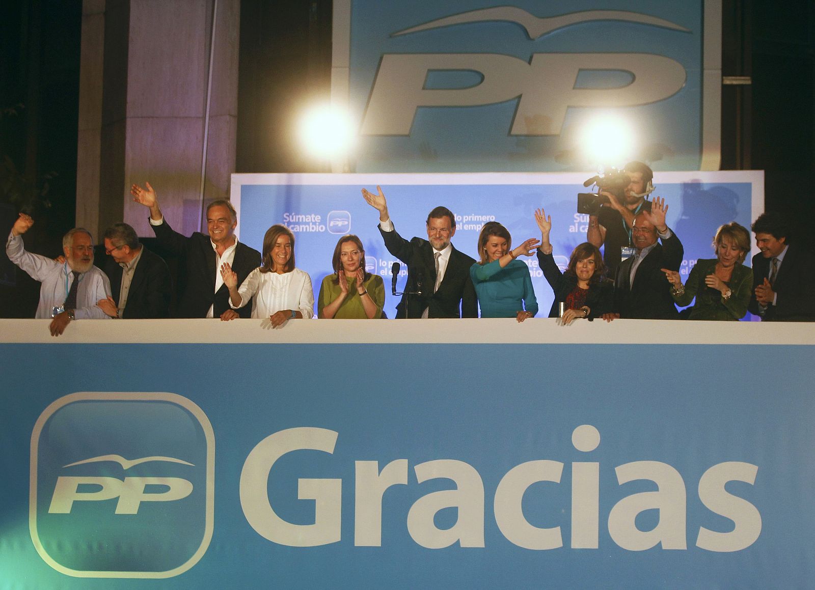 Spain's People's Party leader Rajoy acknowledges supporters next to his wife and members of his party after claiming victory in general elections in Madrid