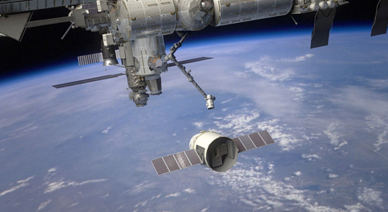 Recreación artística de la llegada de la cápsula 'Dragon' a la Estación Espacial Internacional