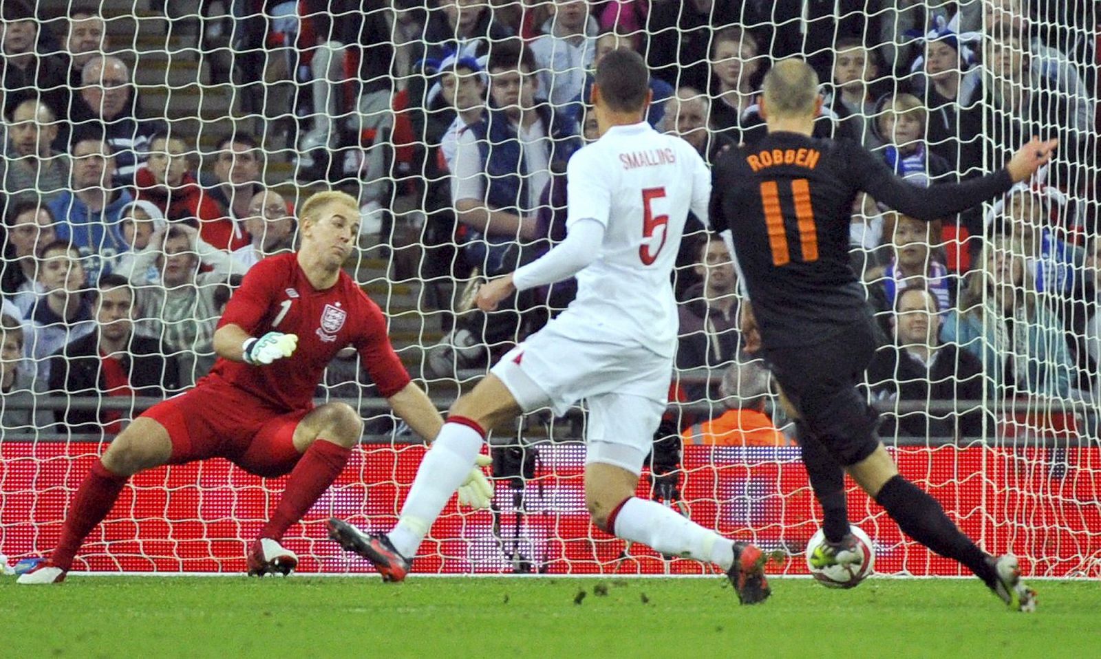 Holland's Arjen Robben scores against England during their international friendly soccer match at Wembley Stadium in London