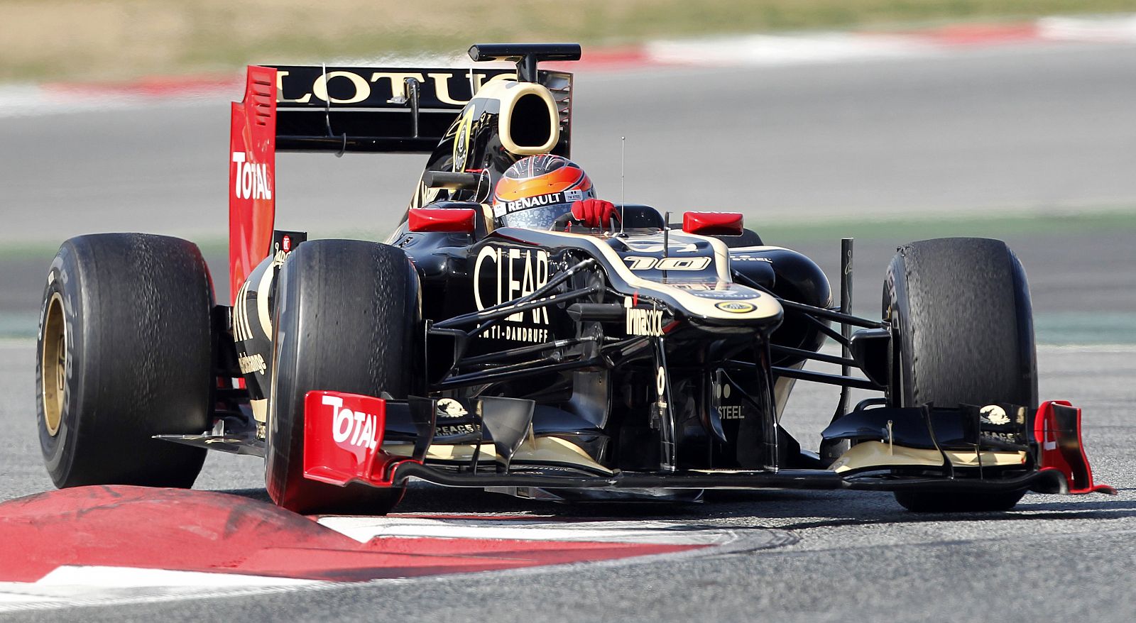 Lotus F1 driver Romain Grosjean of Switzerland takes a curve during a training session at Circuit de Catalunya racetrack