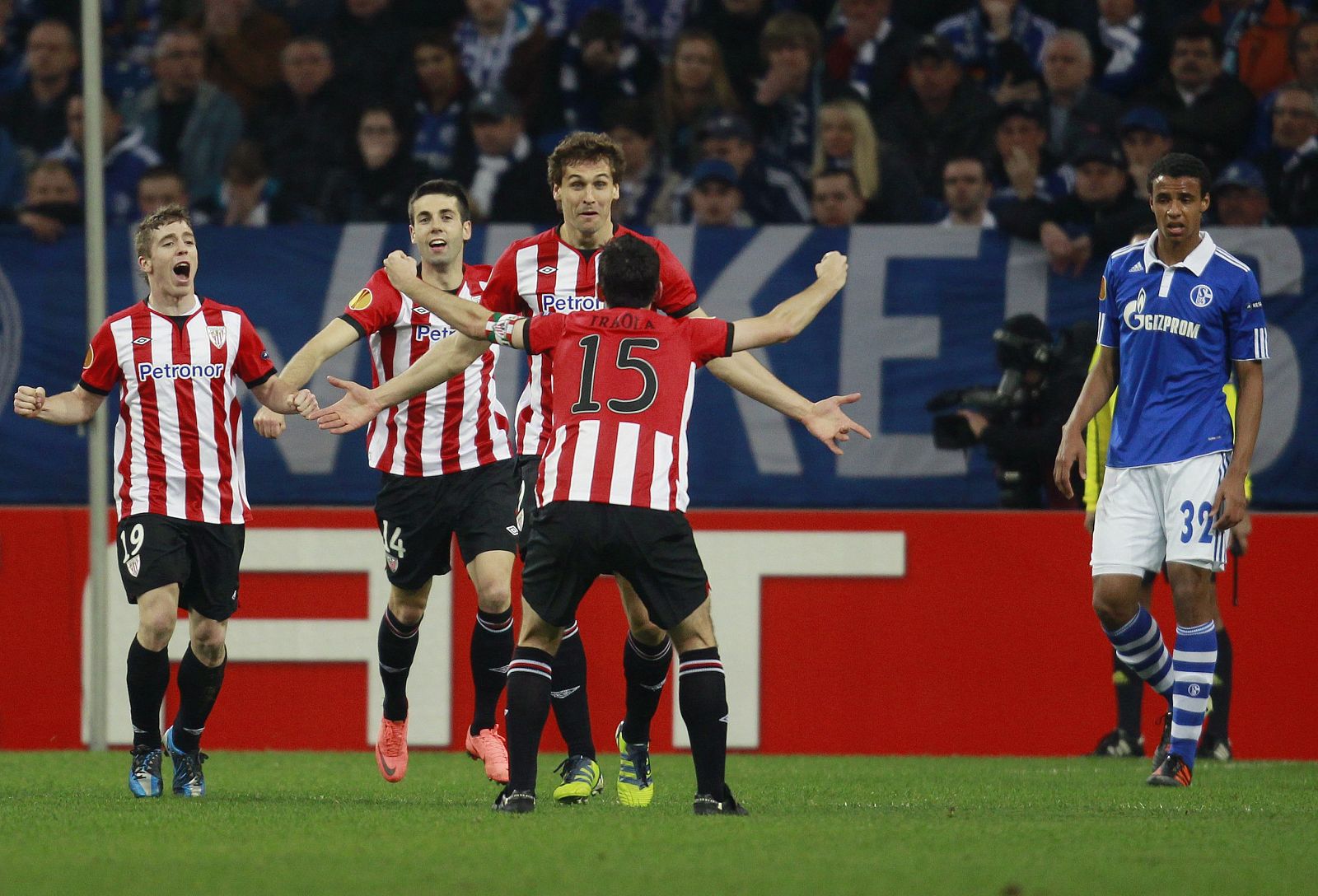 Athletic Bilbao's Llorente and Iraola celebrate a goal against Schalke 04 during the Europa League quarter-final match in Gelsenkirchen