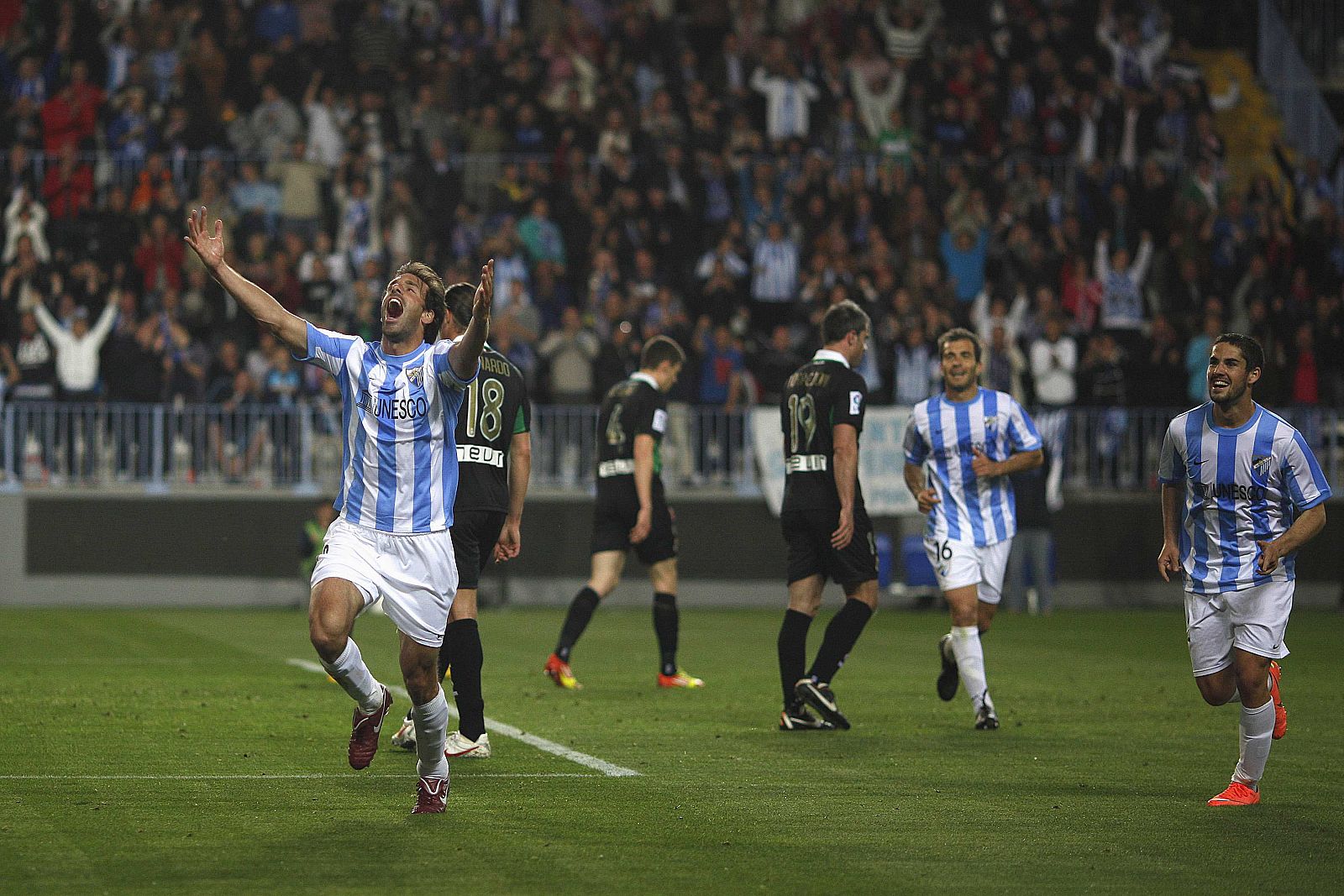 Malaga's Van Nistelrooy celebrates after scoring a goal against Racing Santander during their Spanish First Division soccer match in Malaga