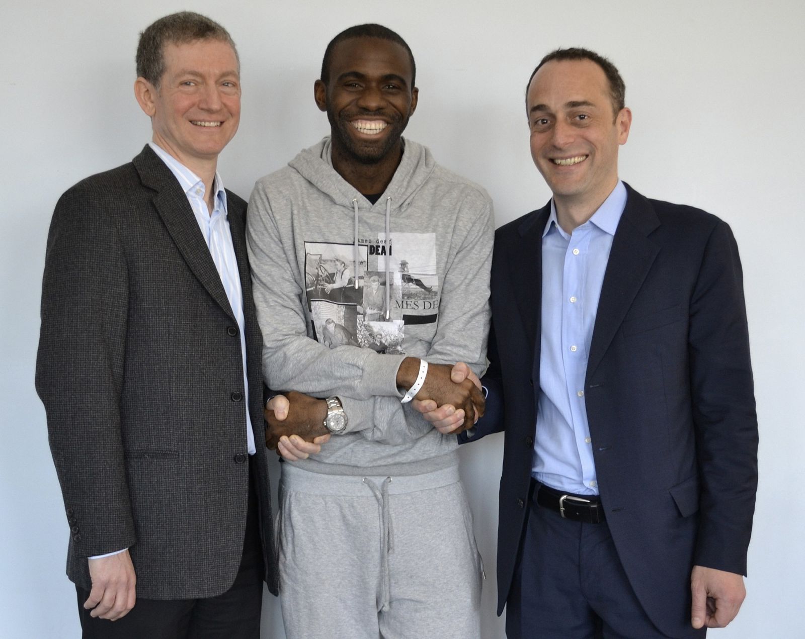 Bolton Wanderers footballer Fabrice Muamba poses for a photograph with Dr Andrew Deaner and Dr Sam Mohiddin in this undated photograph