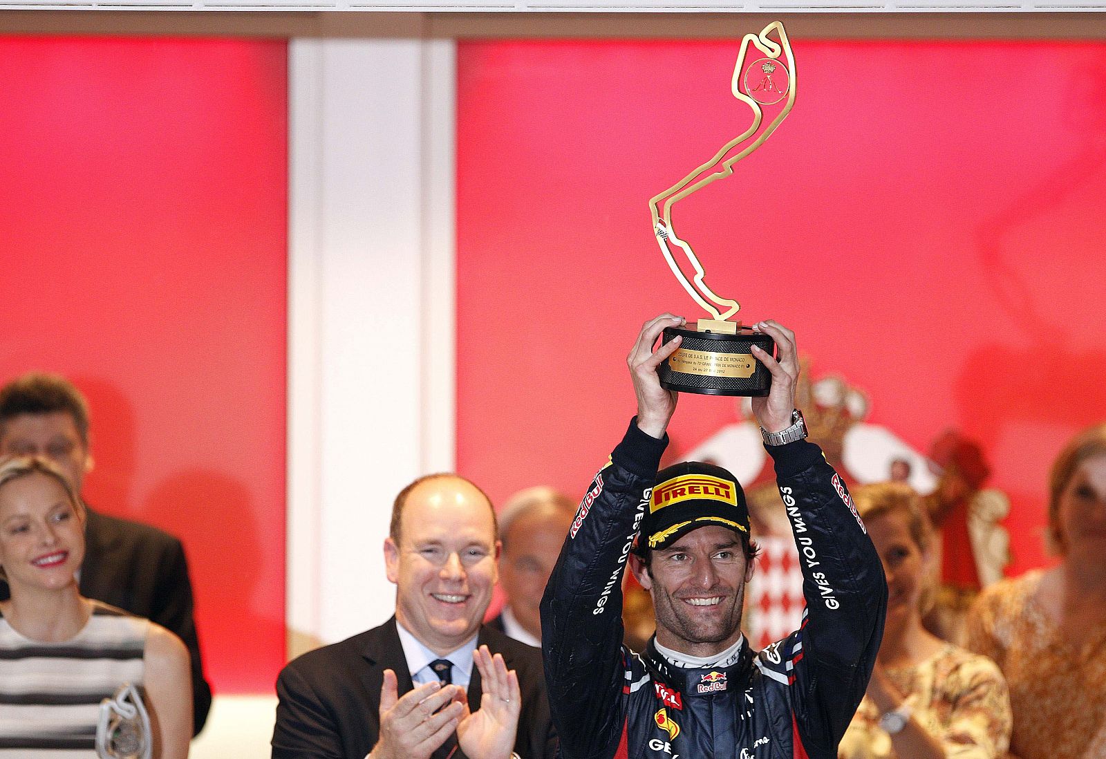 Red Bull Formula One driver Webber of Australia celebrates on the podium after winning the Monaco F1 Grand Prix