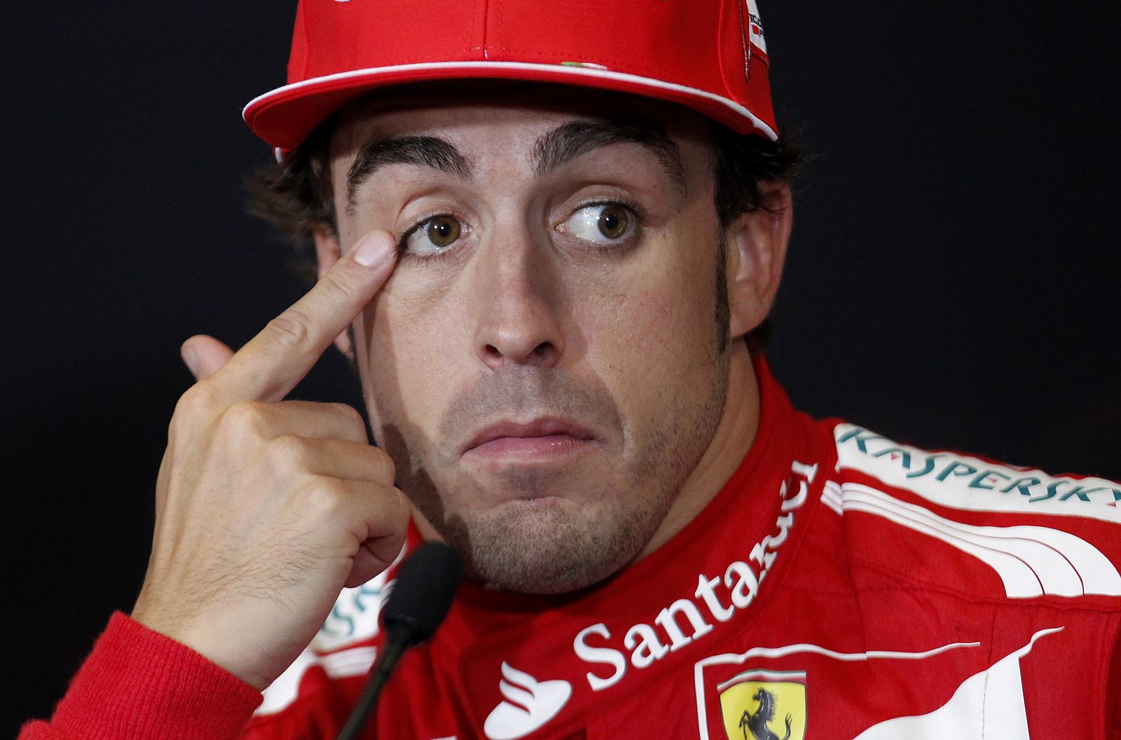 Ferrari Formula One driver Fernando Alonso of Spain attends a news conference after taking second place in the British F1 Grand Prix at Silverstone