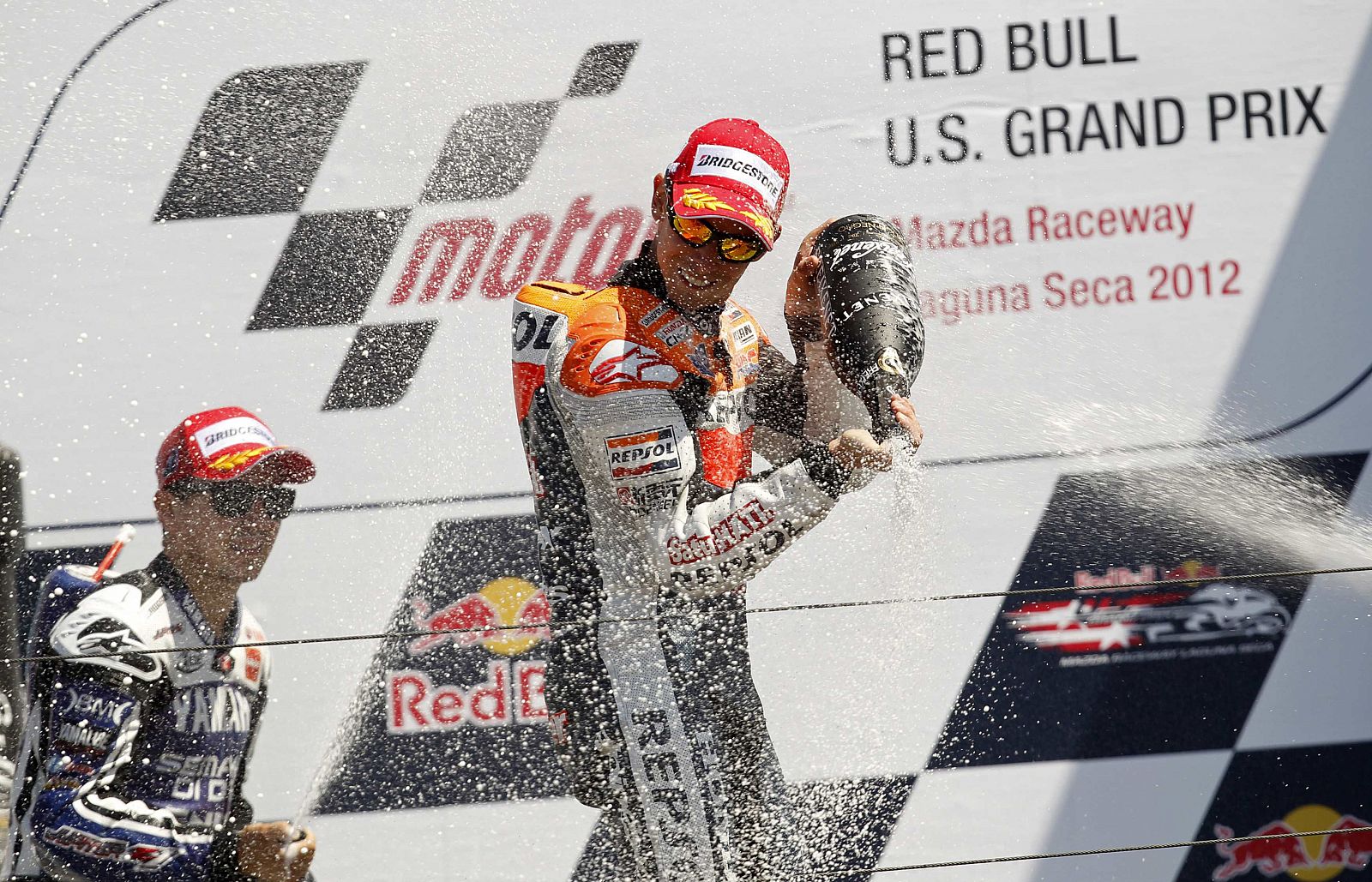 Casey Stoner celebra su triunfo en Laguna Seca junto a Jorge Lorenzo