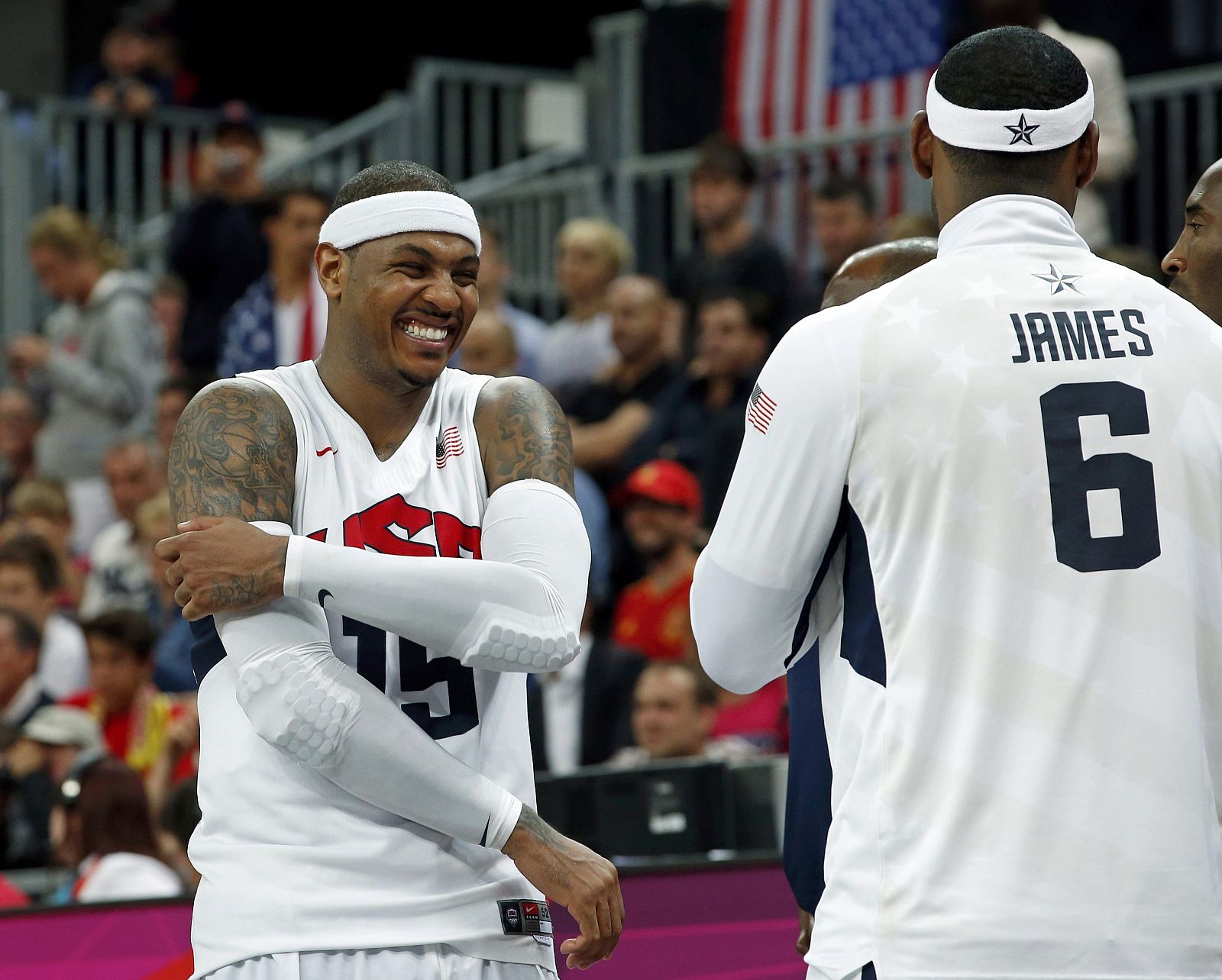 Anthony of the U.S. celebrates with  James as he breaks the all-time single game scoring record during the men's preliminary round Group A basketball match against Nigeria at the Basketball Arena during the London 2012 Olympic Games