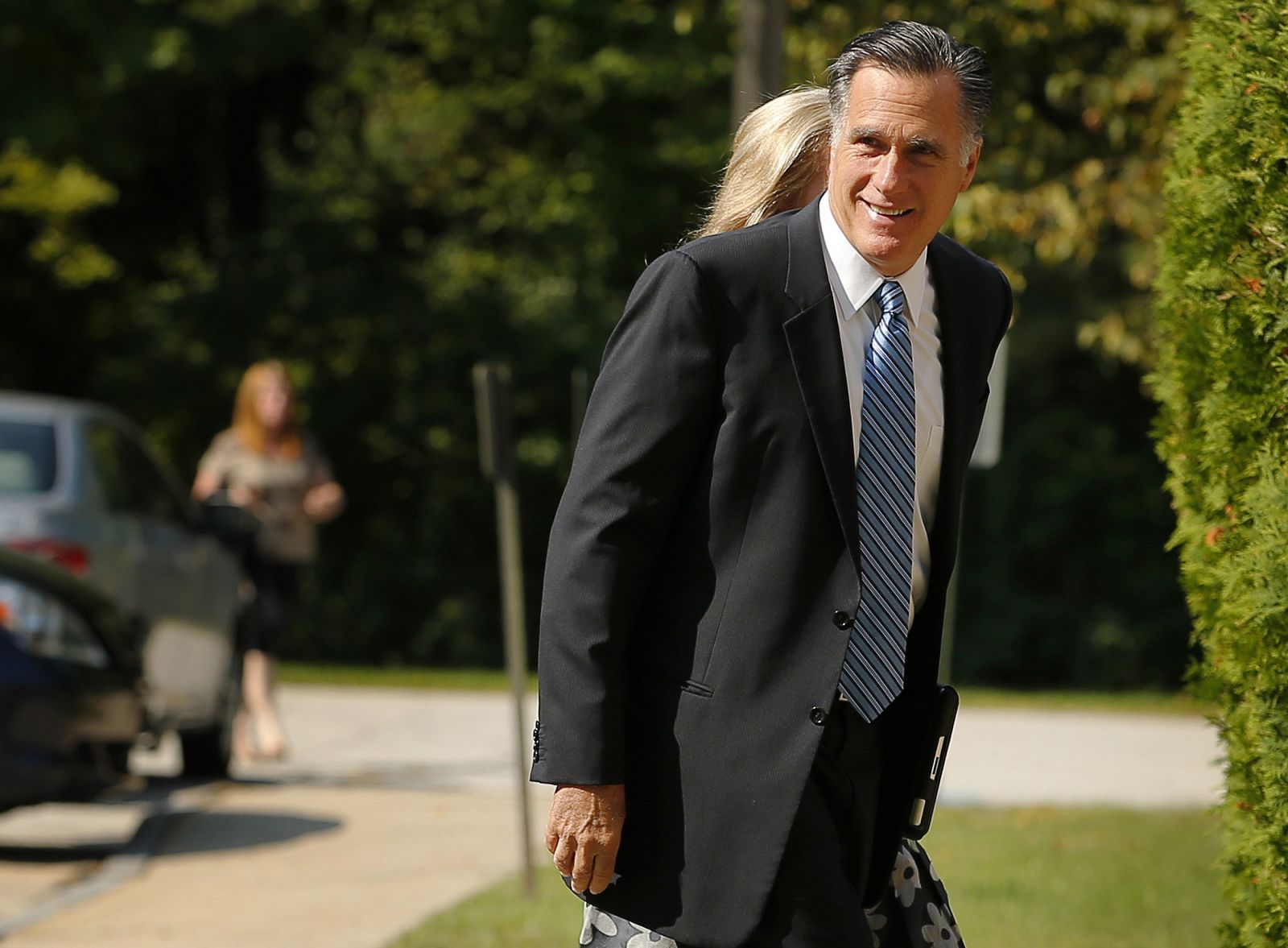 Republican presidential candidate and former Massachusetts Governor Mitt Romney arrives for services at The Church of Jesus Christ of Latter-Day Saints in Wolfboro