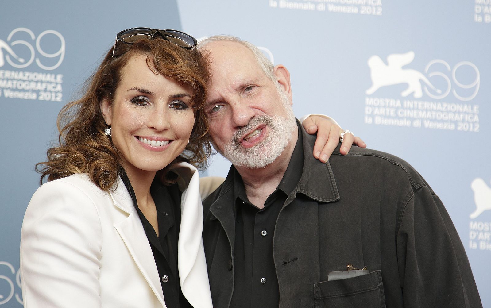 Director De Palma and actress Rapace pose during the photocall of the movie "Passion" at the 69th Venice Film Festival in Venice