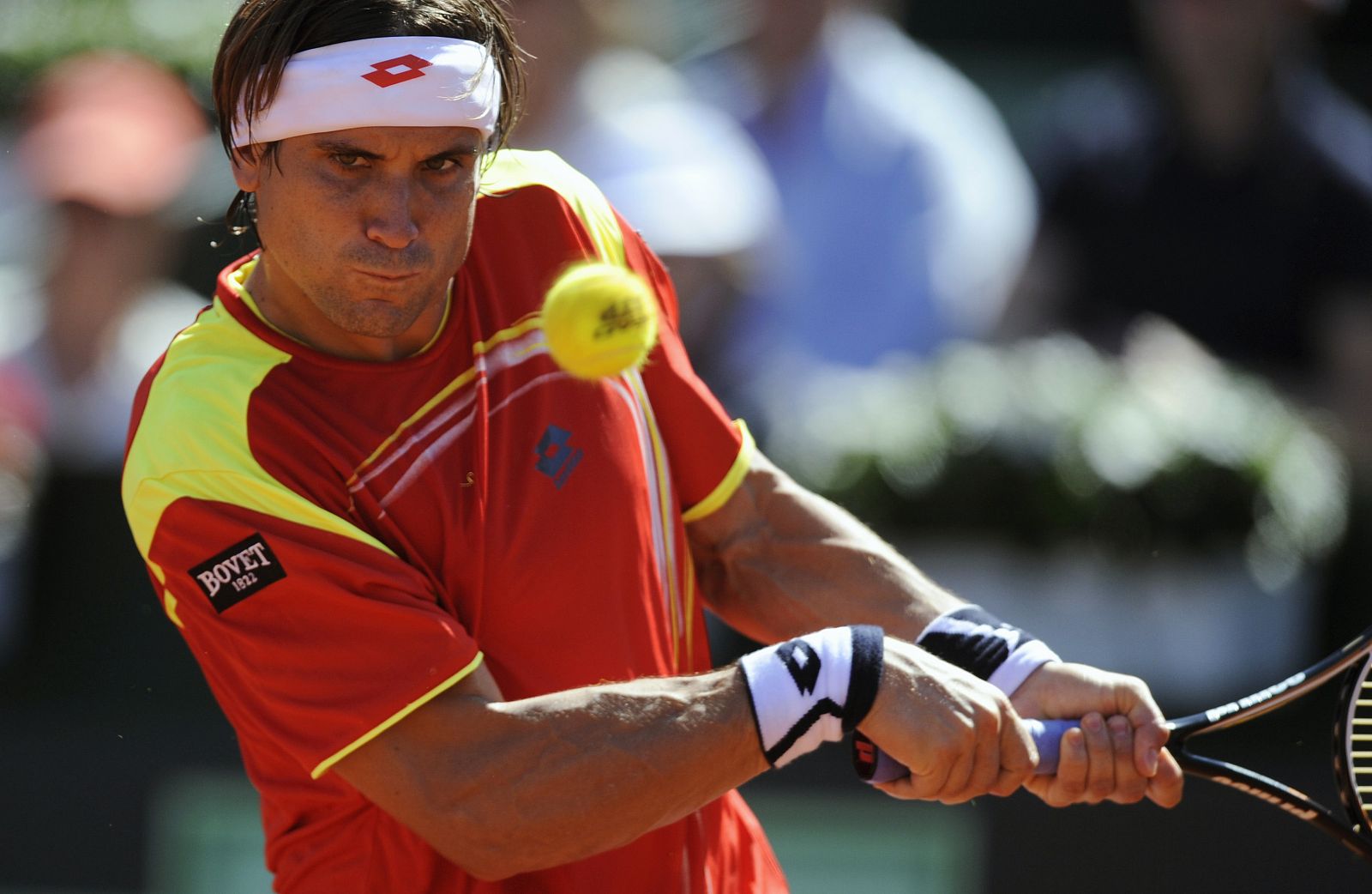Ferrer of Spain returns a shot to Querrey of the U.S. during their Davis Cup World Group semi-final match in Gijon