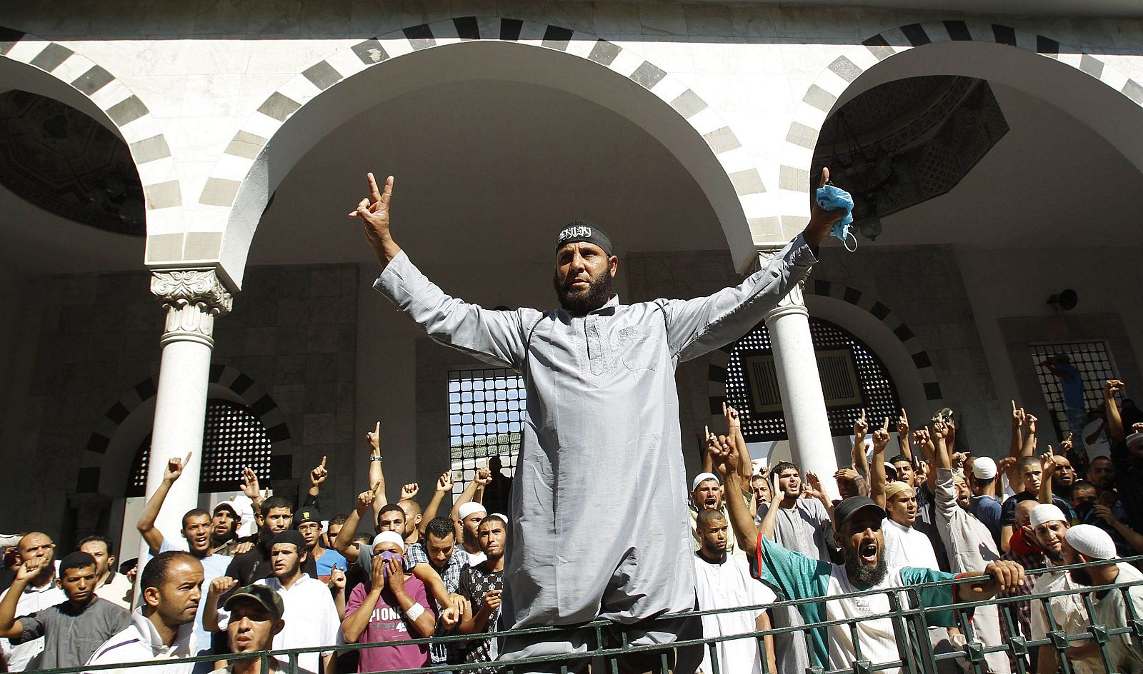 Protesters shout slogans during a demonstration at the al-Fatah mosque in Tunis