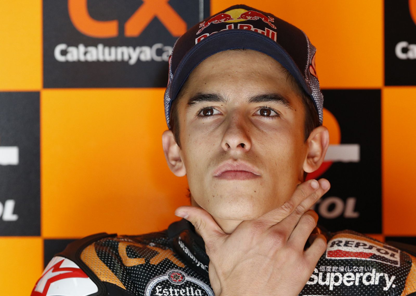 Suter Moto2 rider Marquez of Spain sits in his pit garage during a free practice session for Sunday's Japanese Grand Prix in Motegi