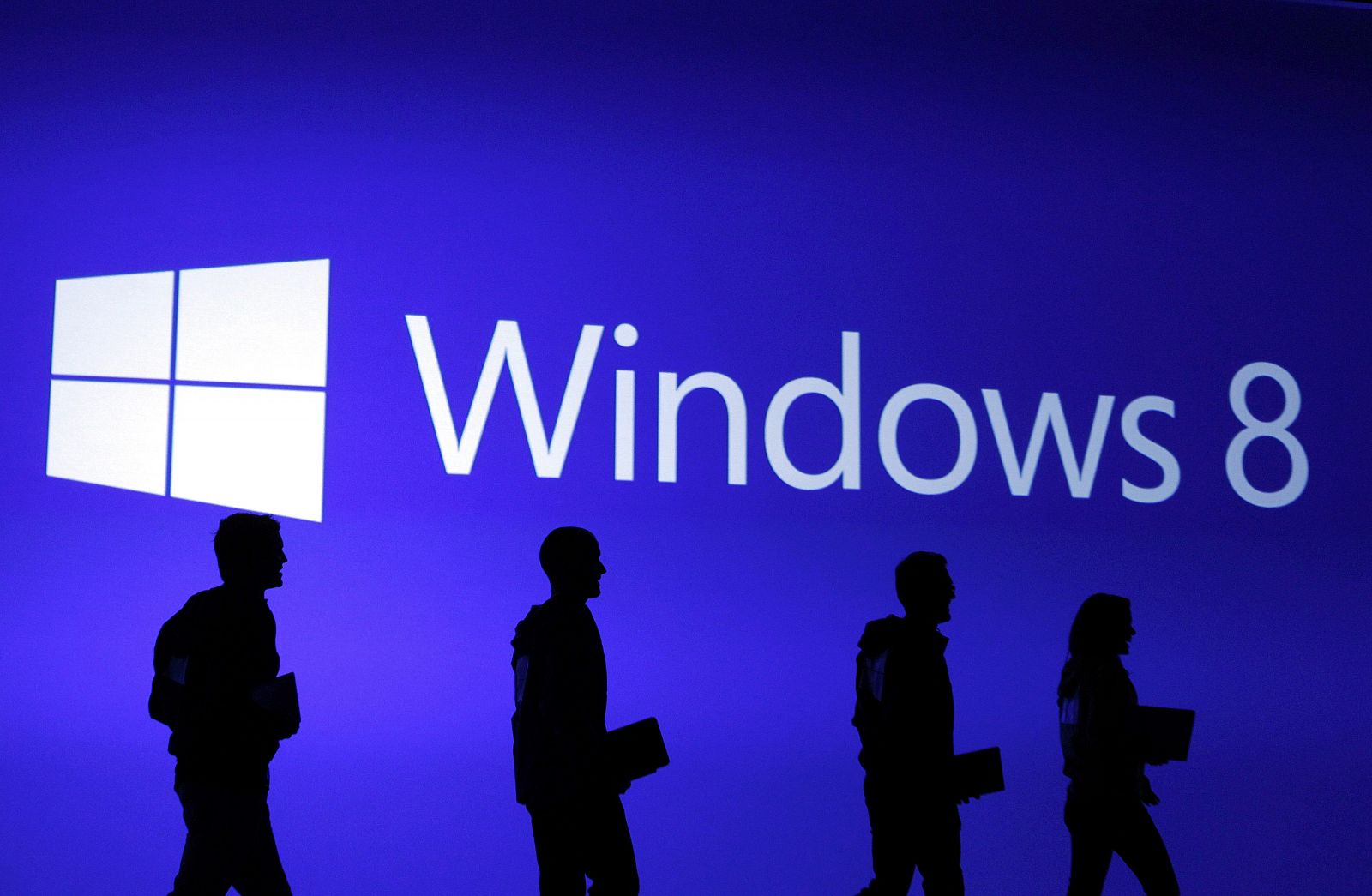 Guests are silhouetted at  the launch event of Windows 8 operating system in New York